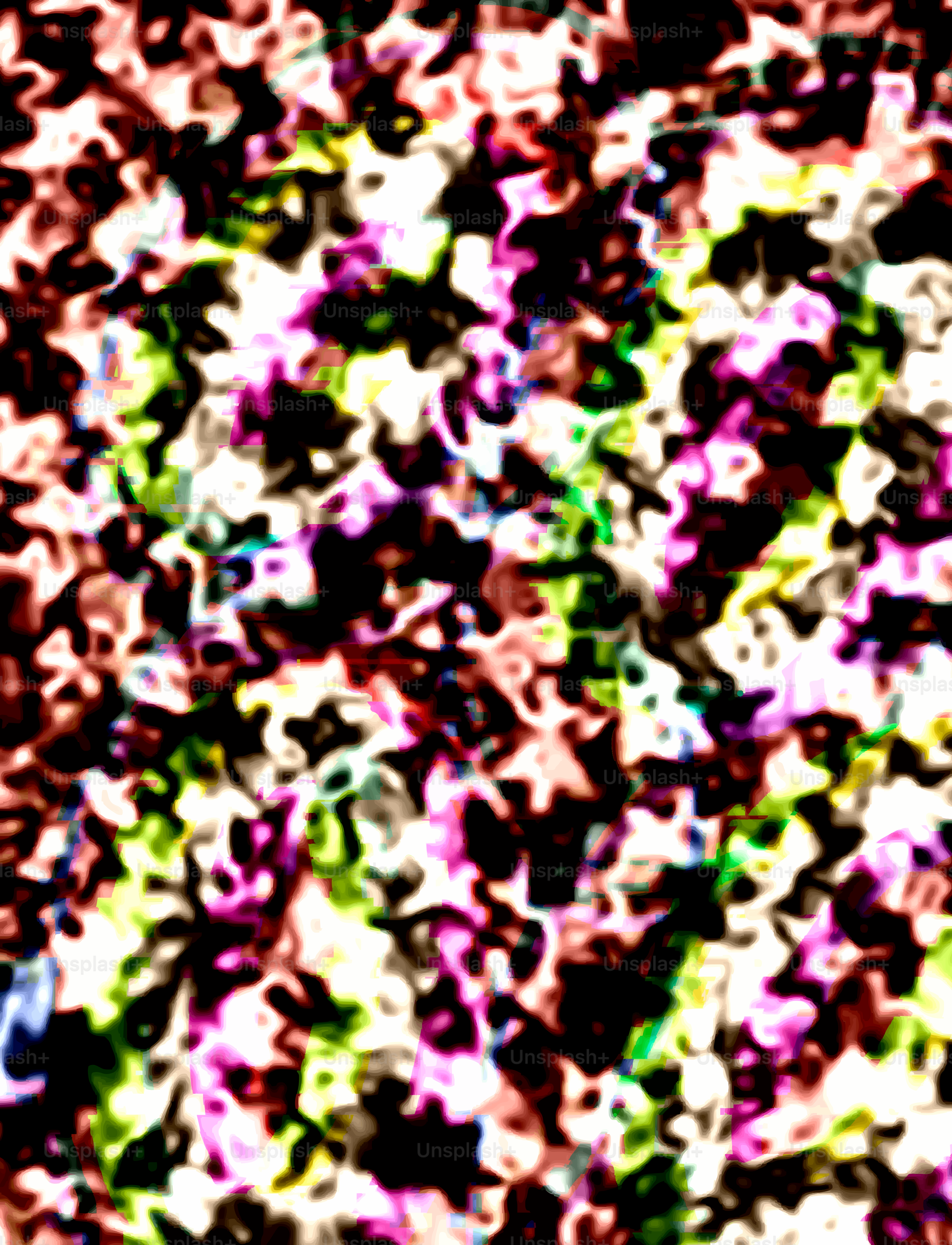 Abstraktes, farbenfrohes Muster, das einem Sternenhimmel ähnelt.