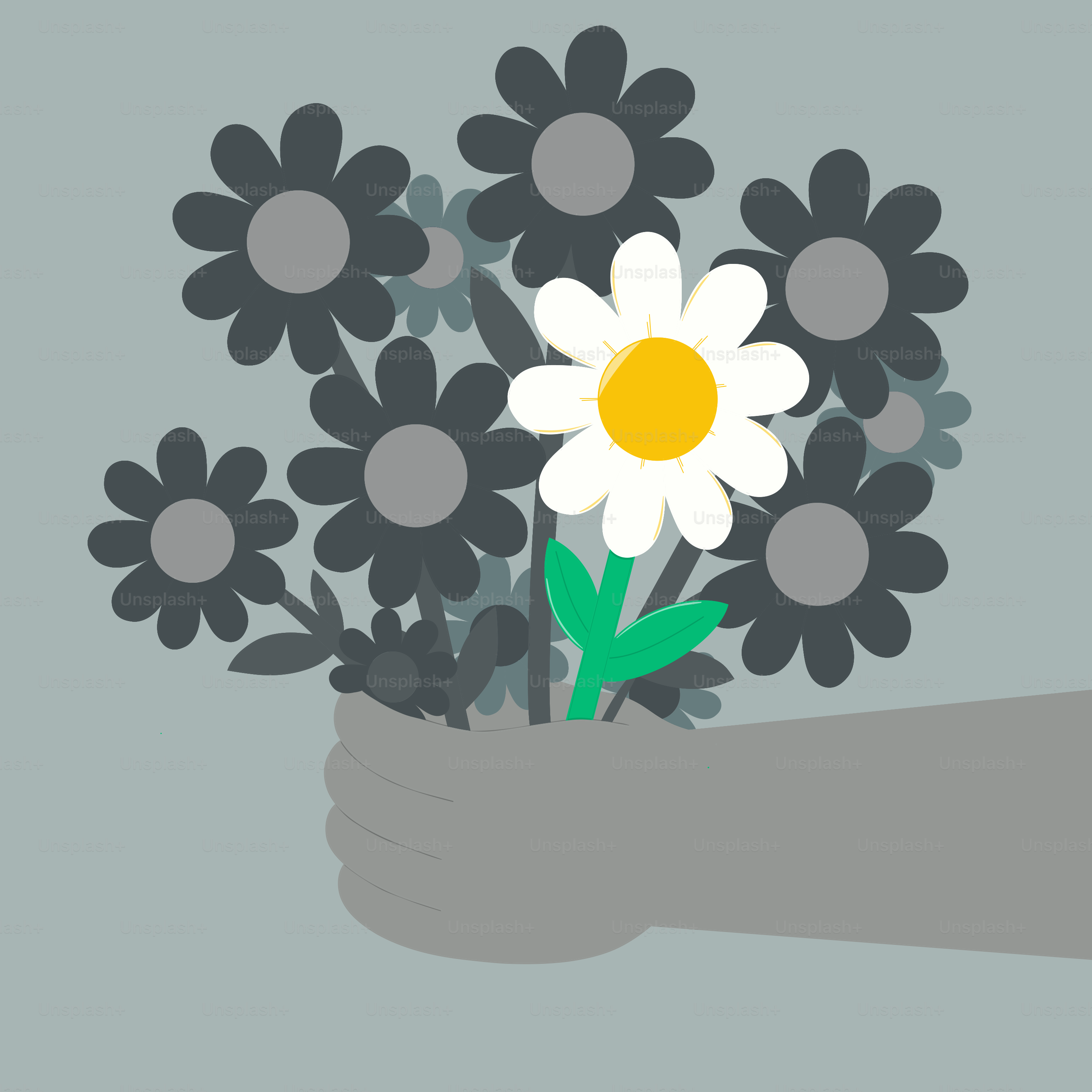 A hand holds a bouquet of unique flowers.