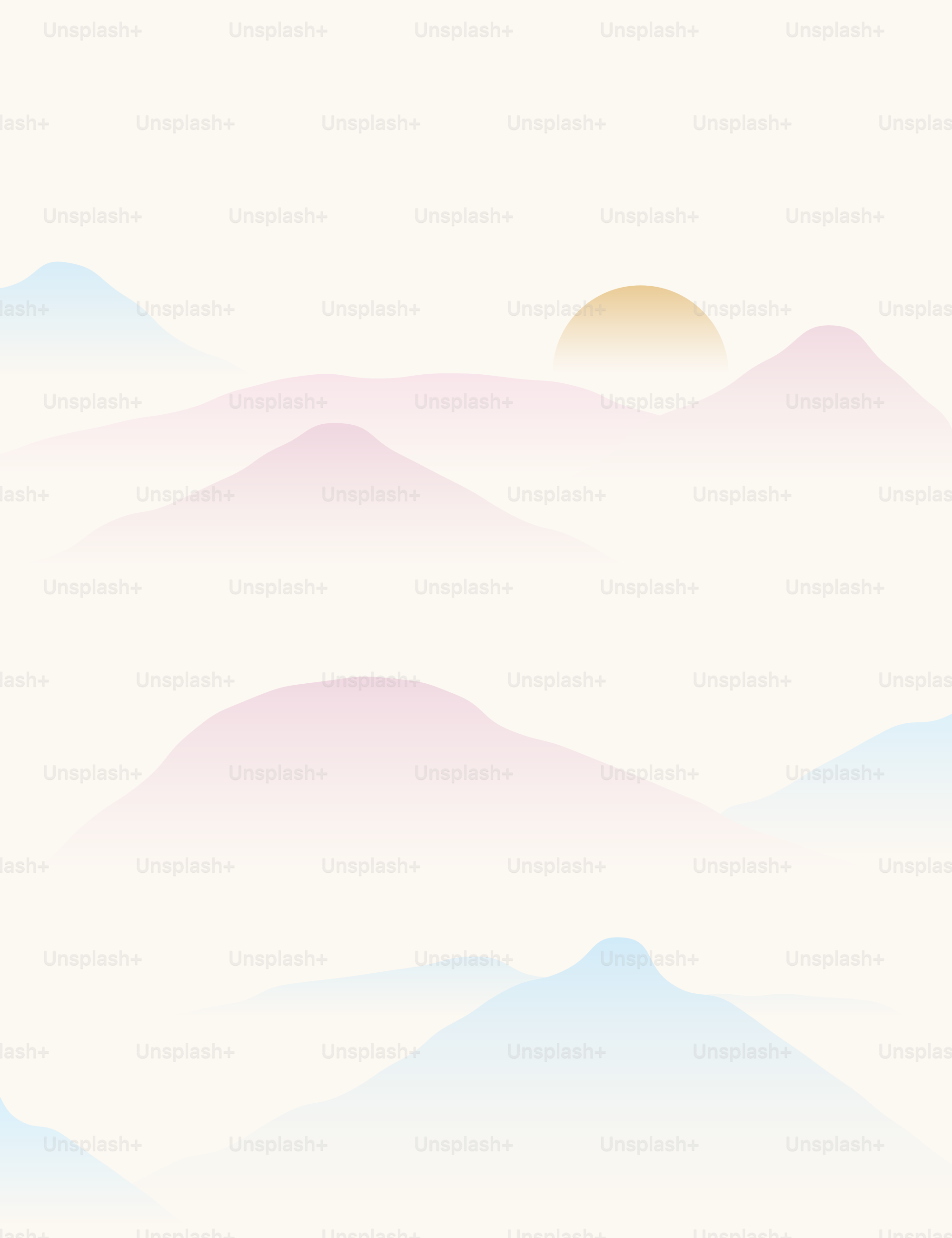 Sunrise over pastel mountain silhouettes.