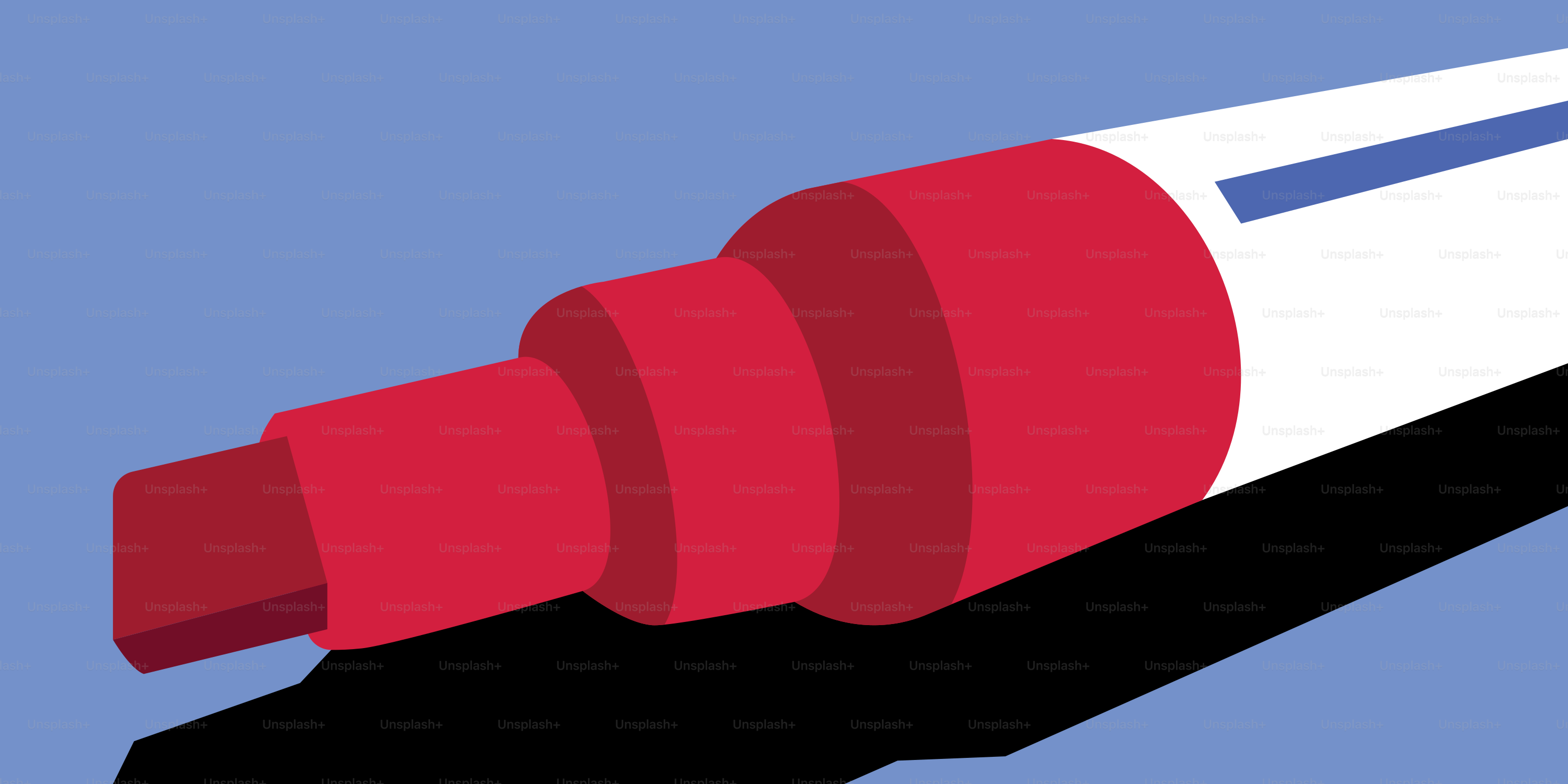 A red marker lies on a blue background.