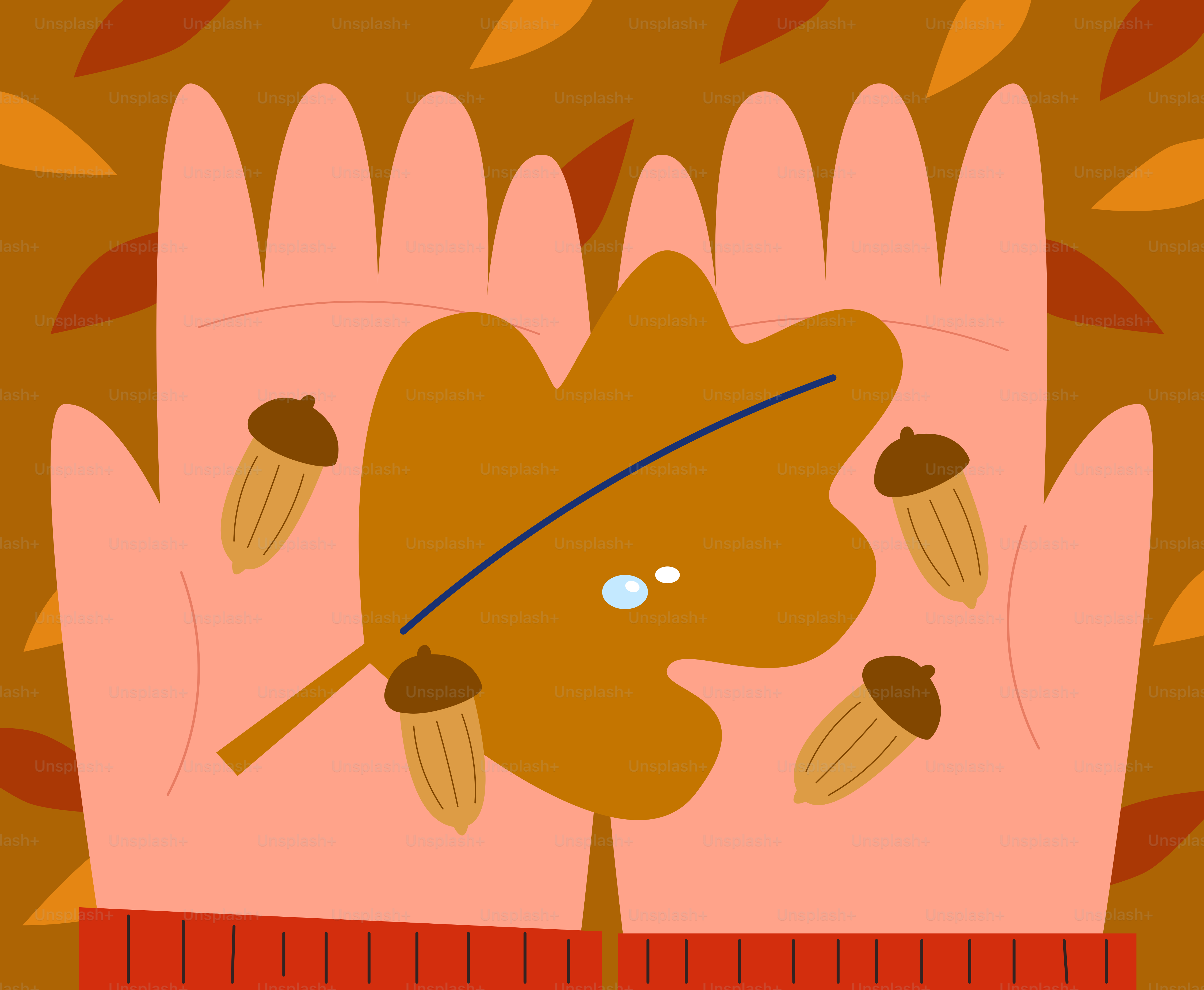 秋の葉と水滴のついたドングリを握る手。