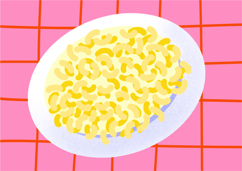 Plate of macaroni and cheese on pink checkered tablecloth.