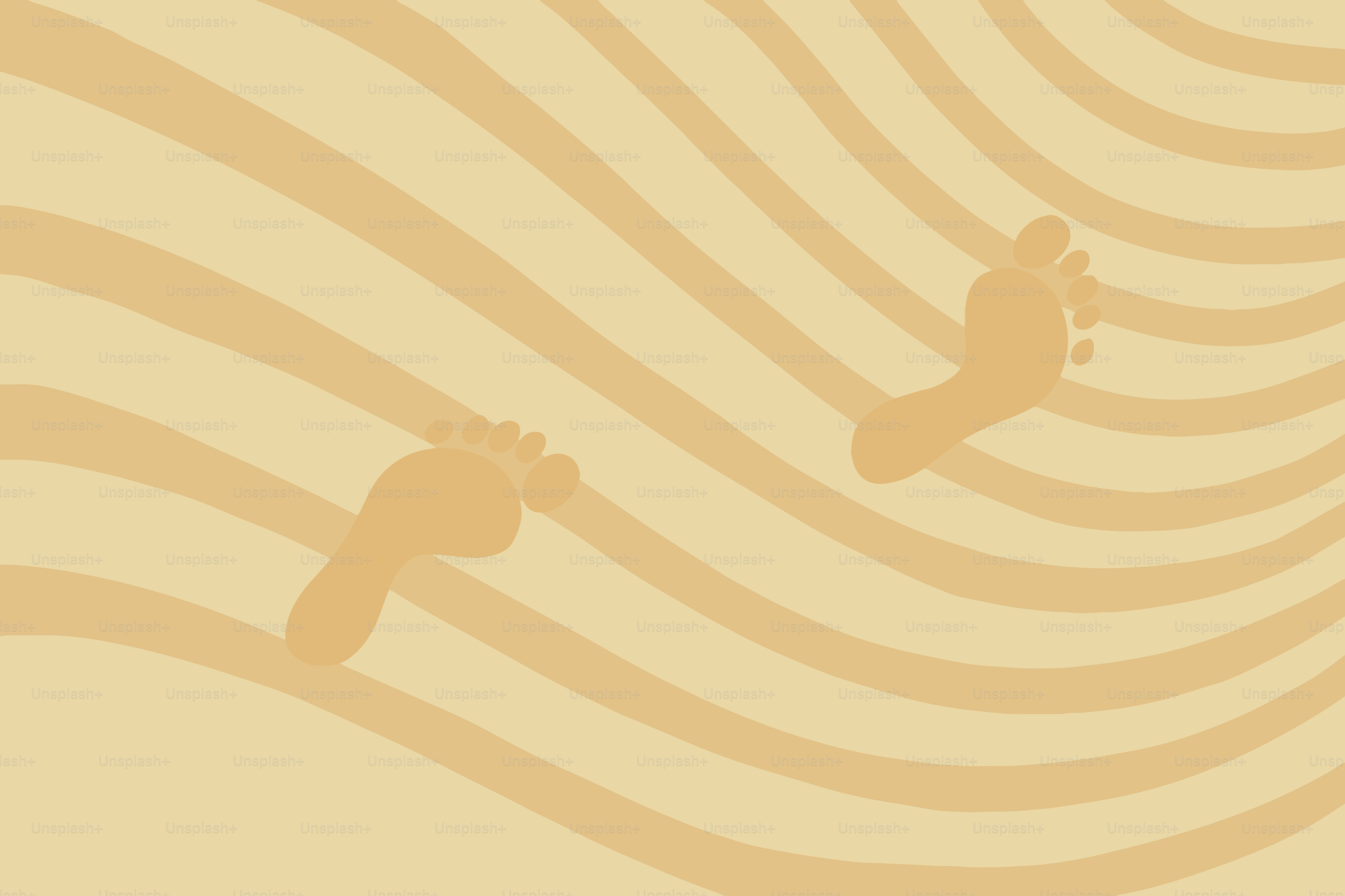 Footprints in wavy sand dunes under a bright sun