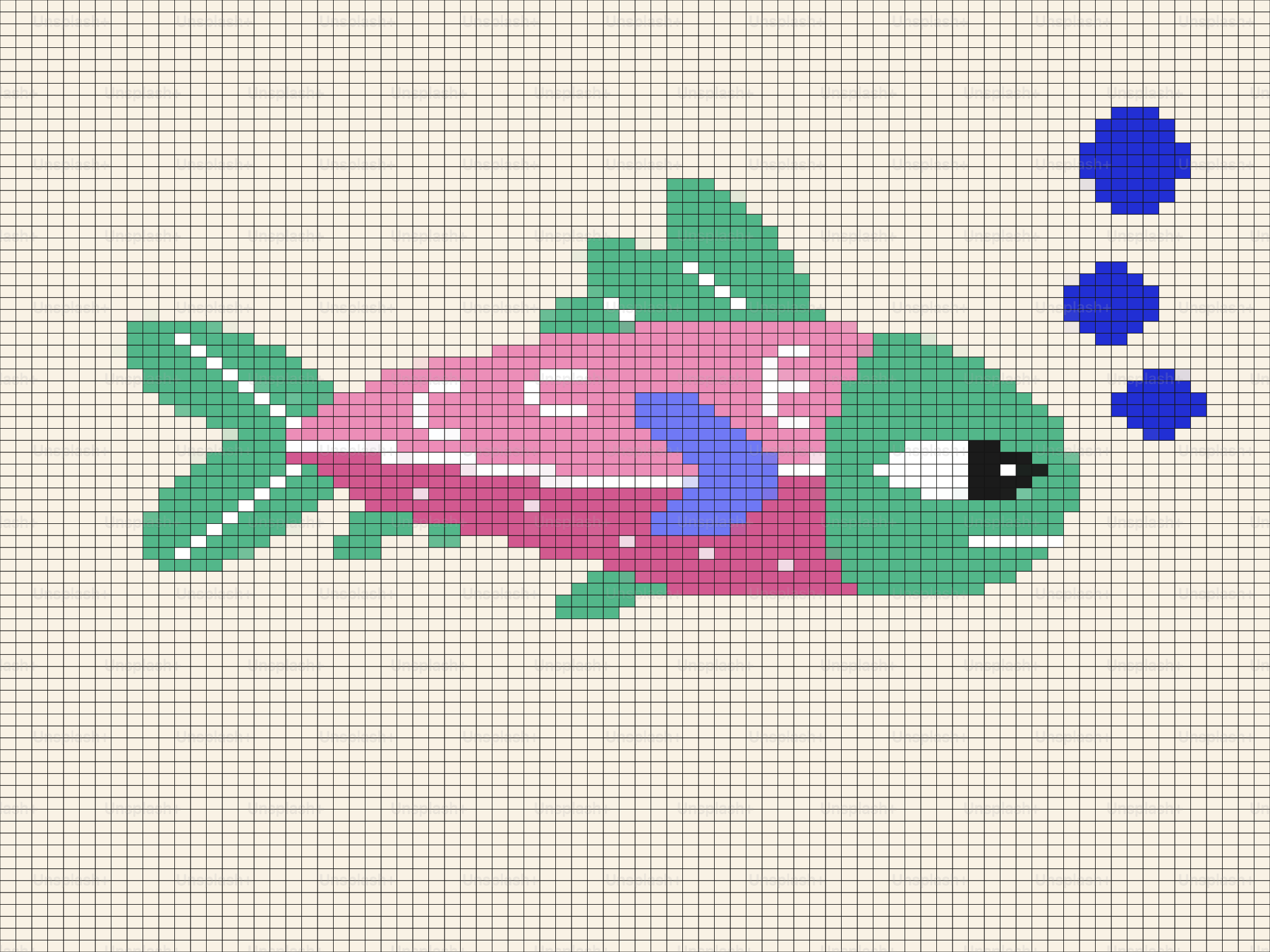 泡のあるピンクと緑の魚のピクセルアート