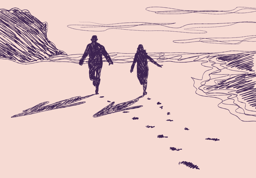 Couple running on beach leaving footprints