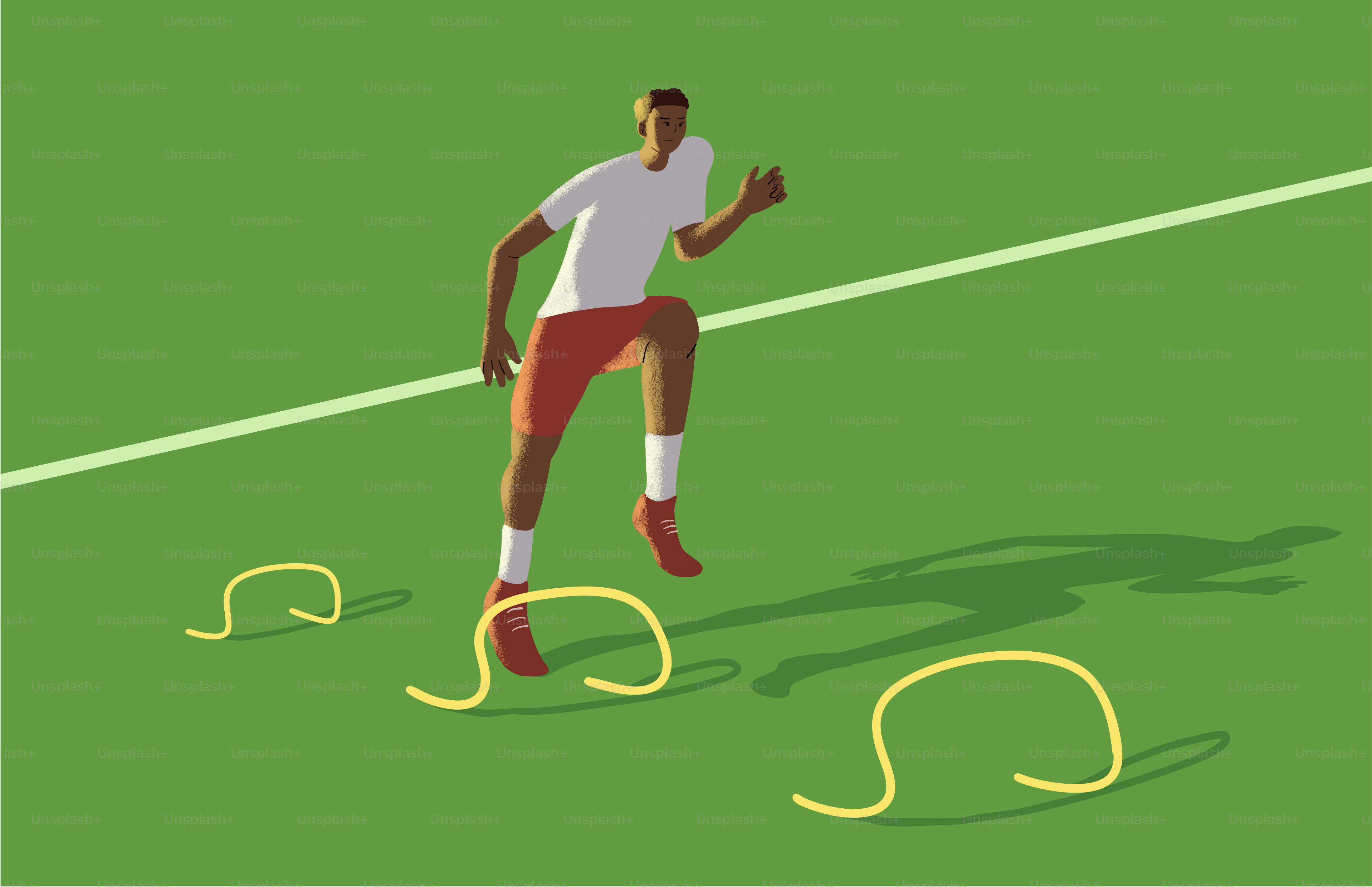 Man jumping over agility hurdles on a green field.
