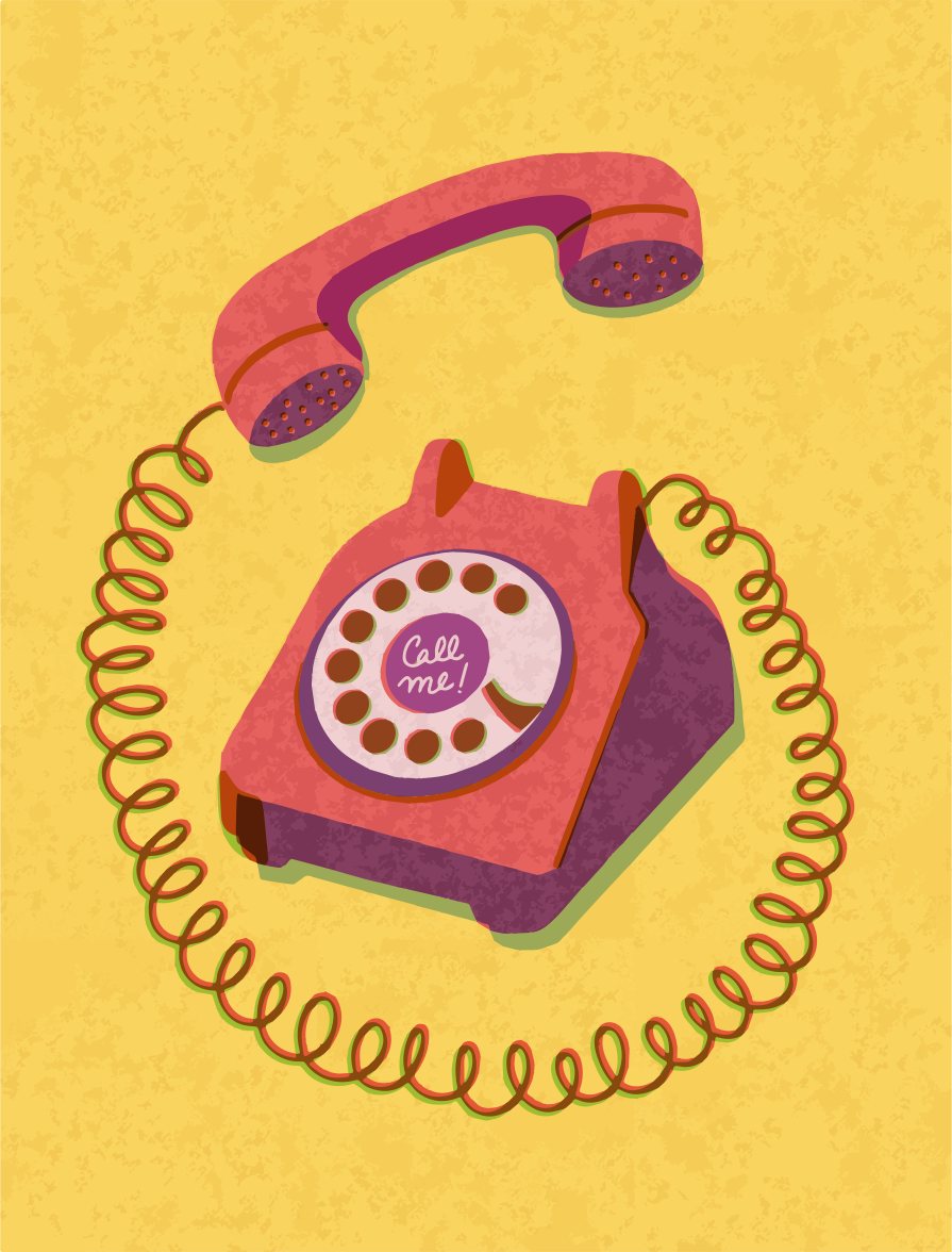 A retro pink rotary phone with a curly cord.