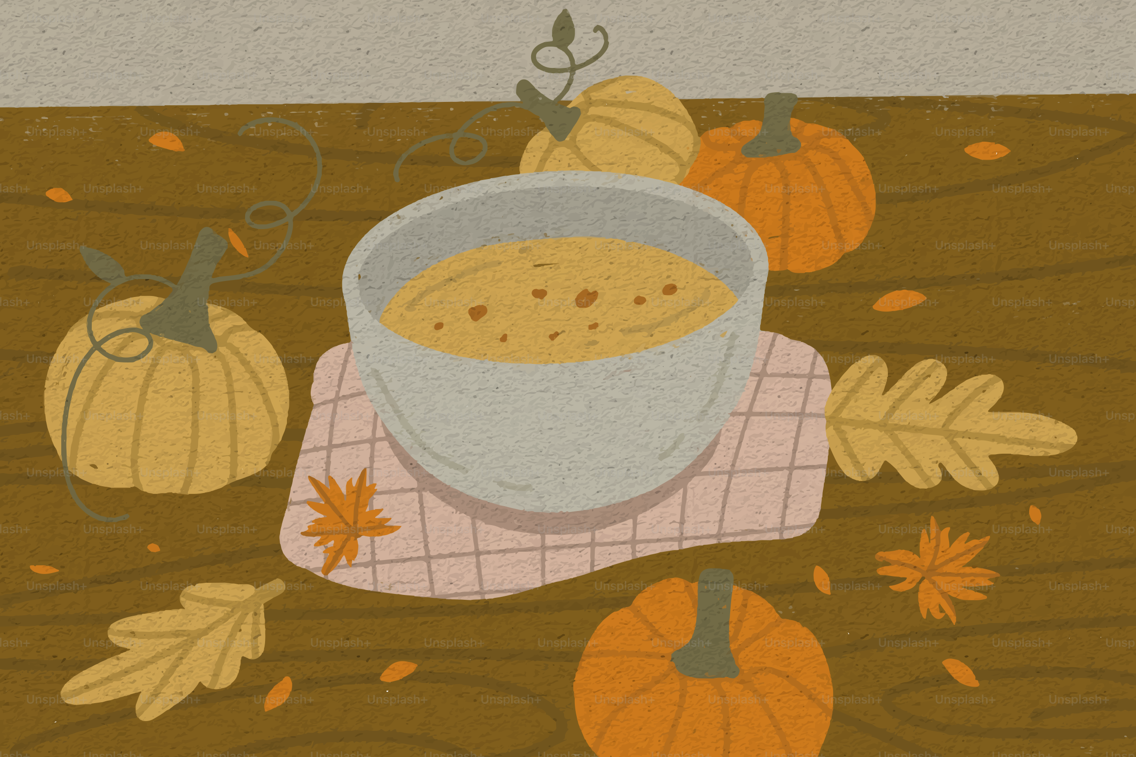Bowl of soup surrounded by pumpkins and autumn leaves