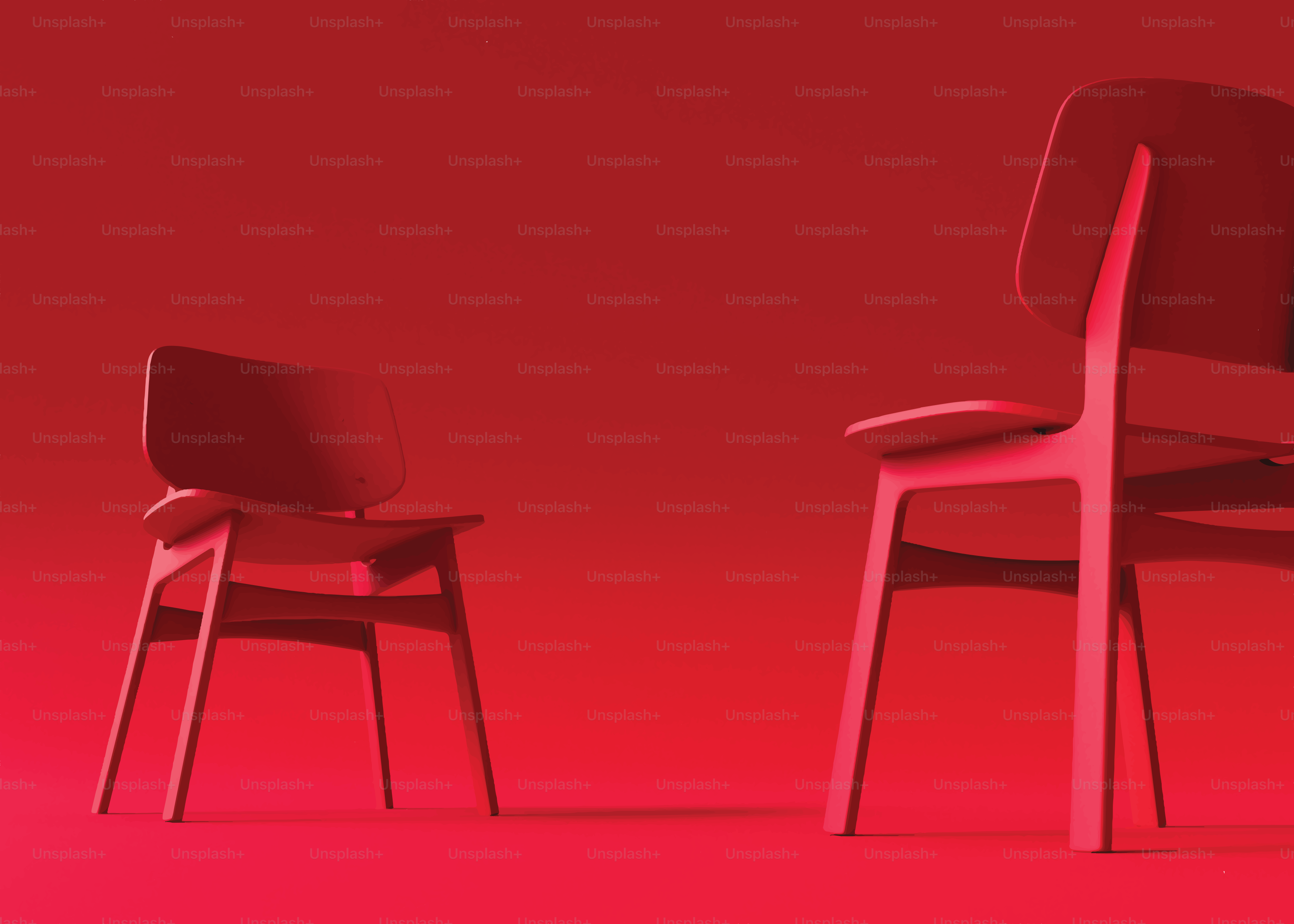 Two red chairs against a red background