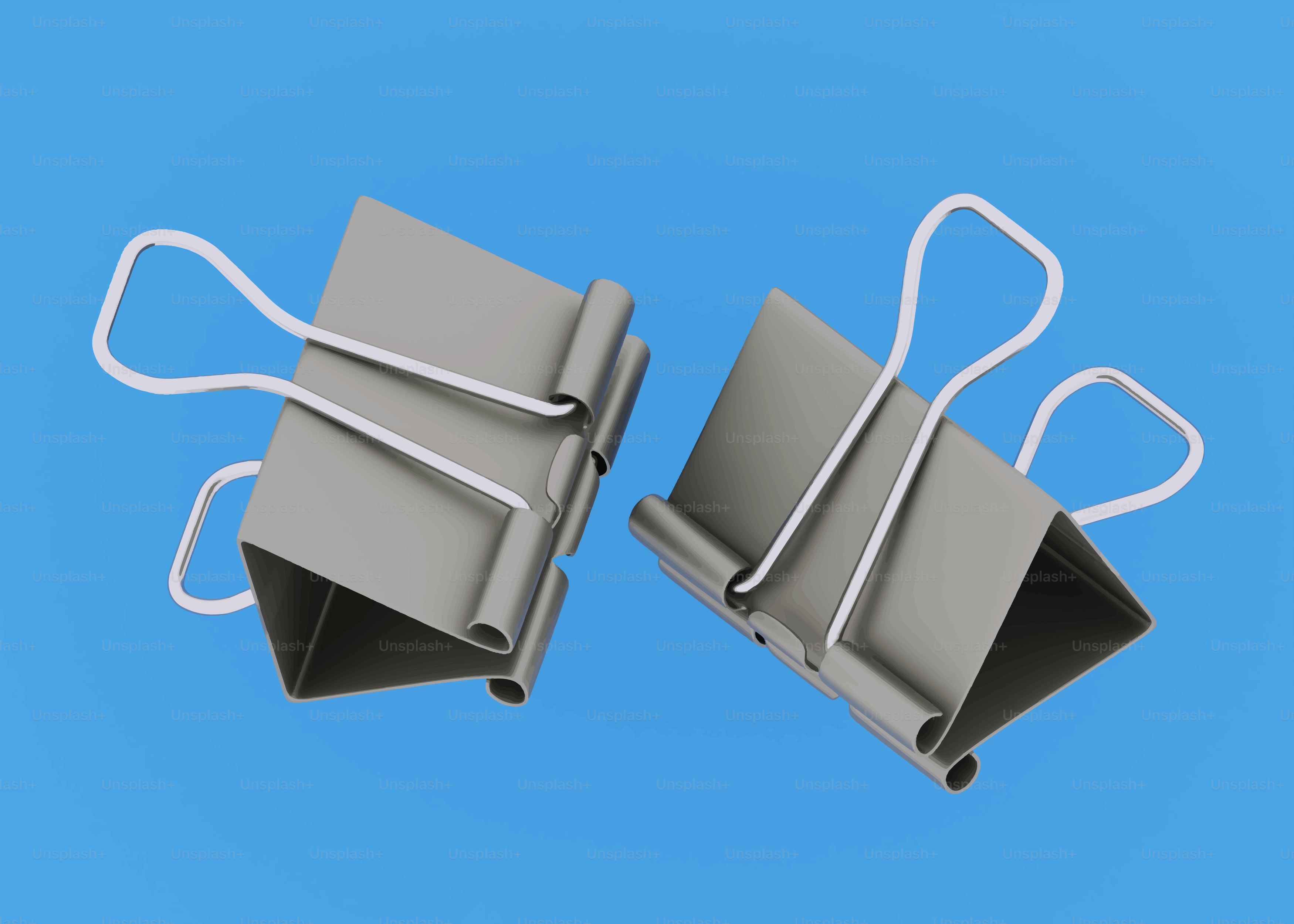 Two binder clips on a blue background