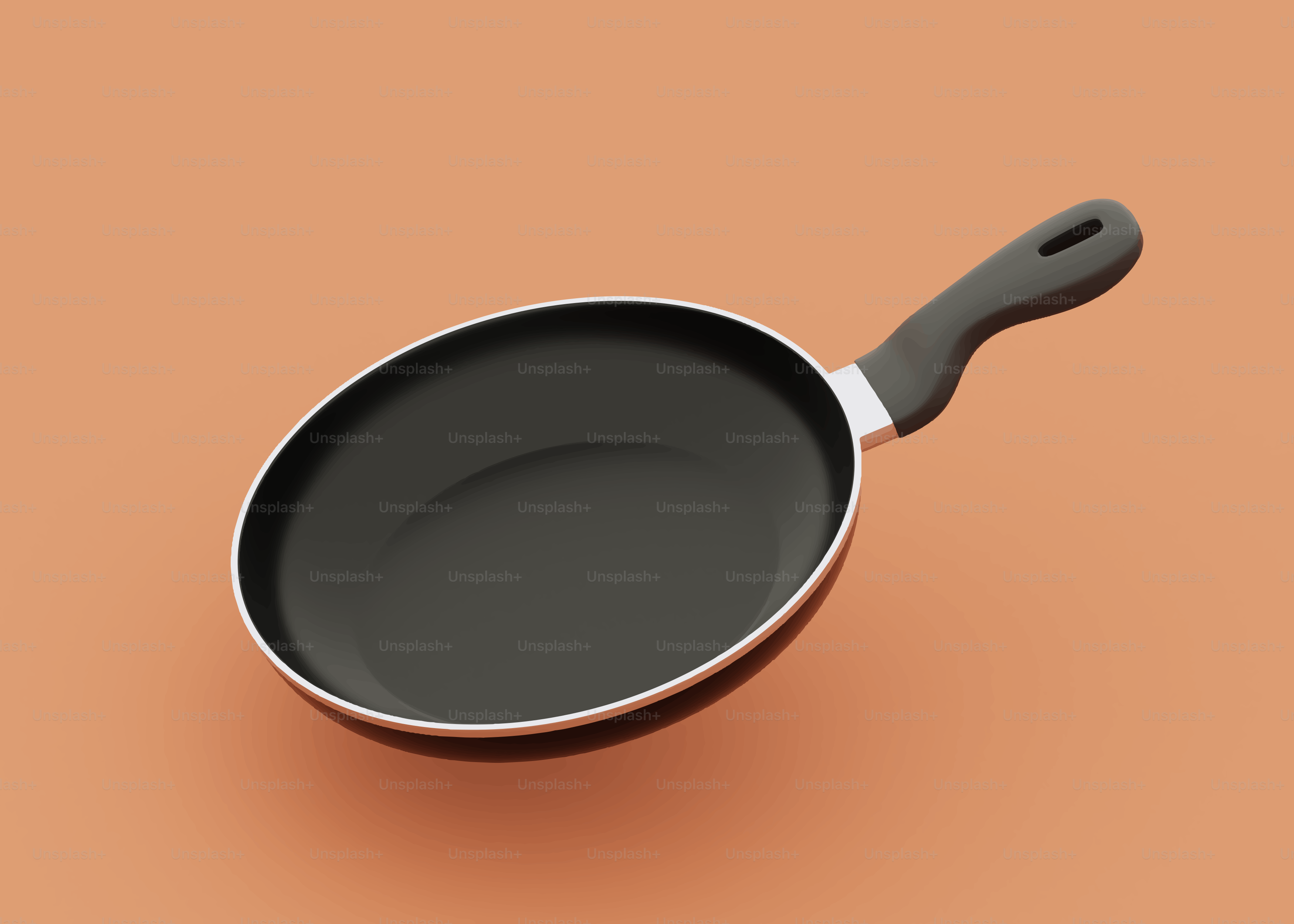 A black frying pan on an orange background