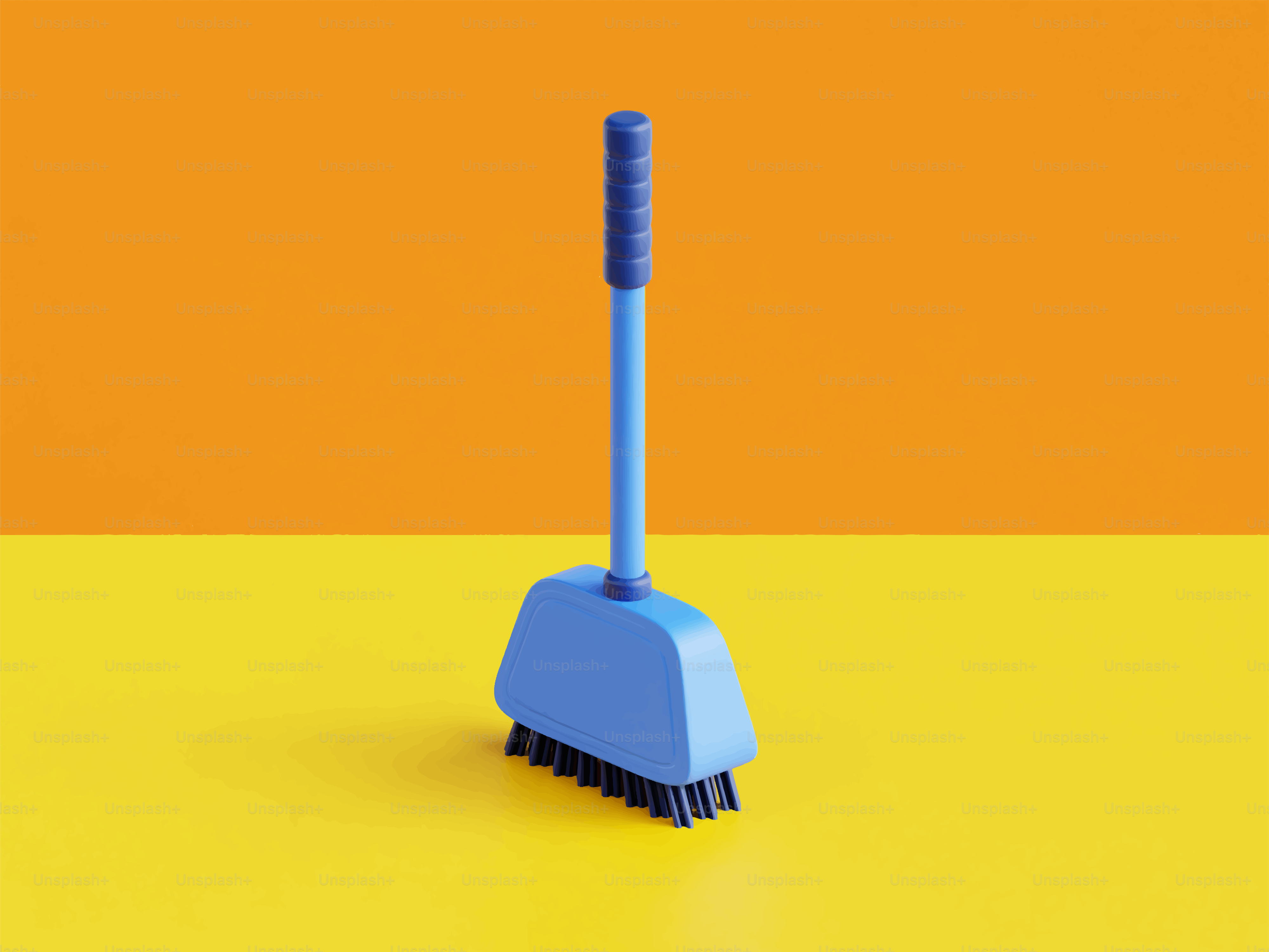A blue broom and dustpan on a yellow surface.