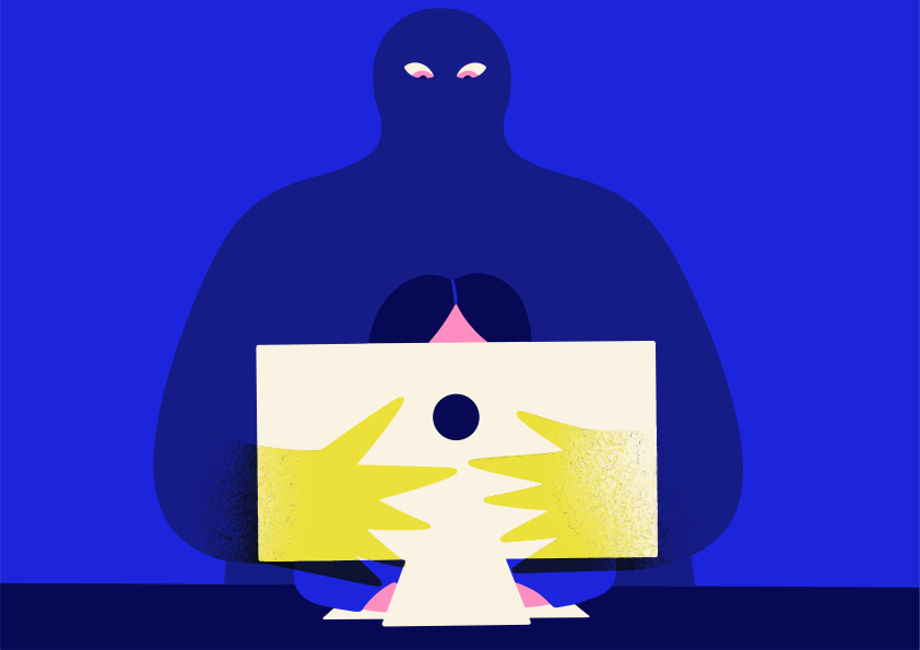 Shadowy figure looms behind person using computer.