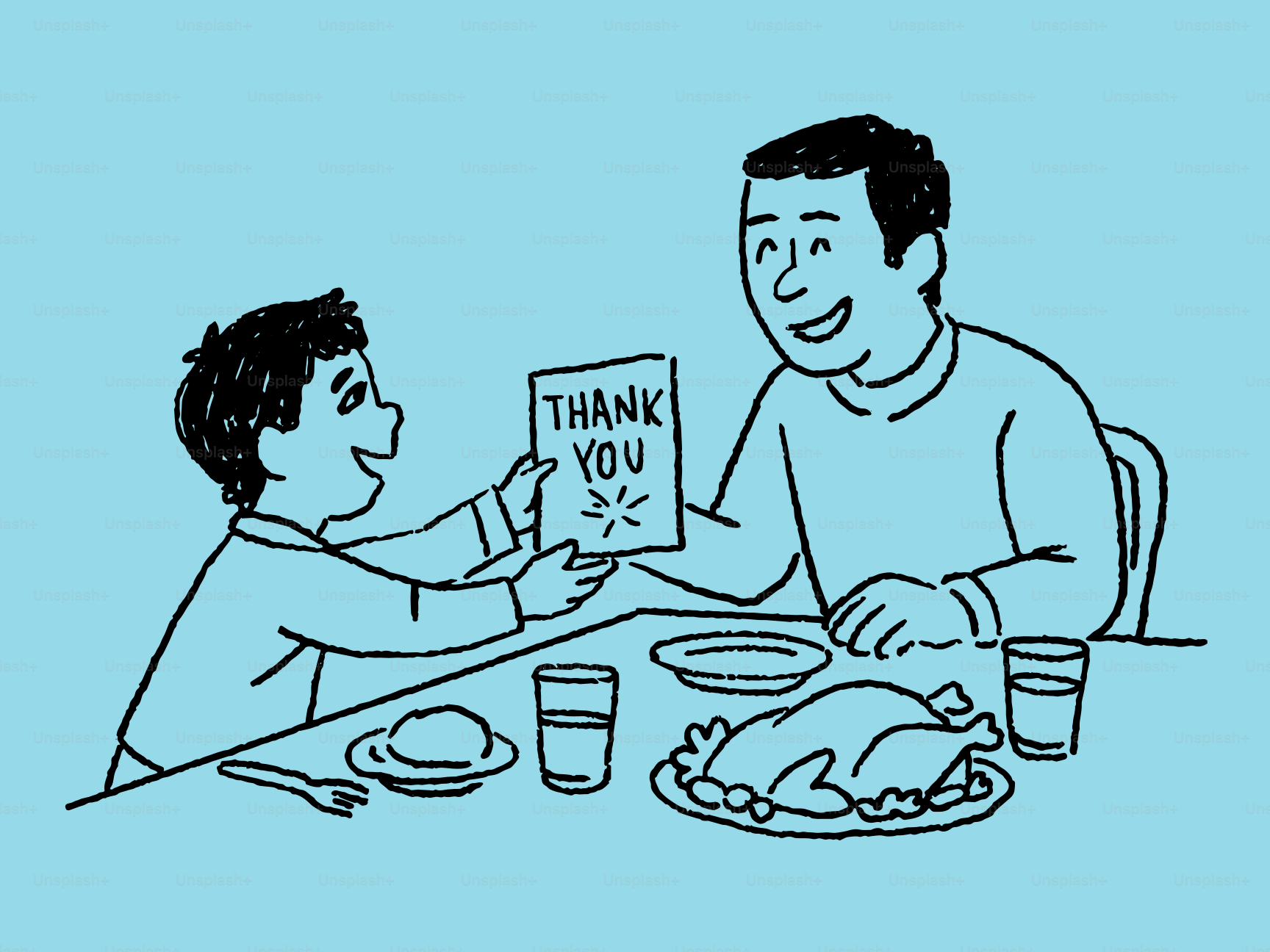 Boy gives father a thank you card at dinner