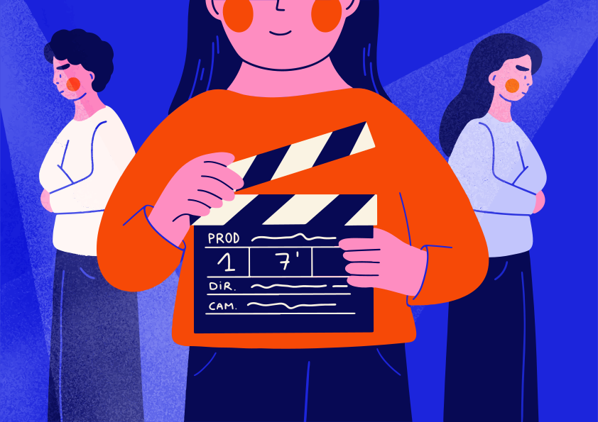 Filmmaker holds clapperboard with actors behind