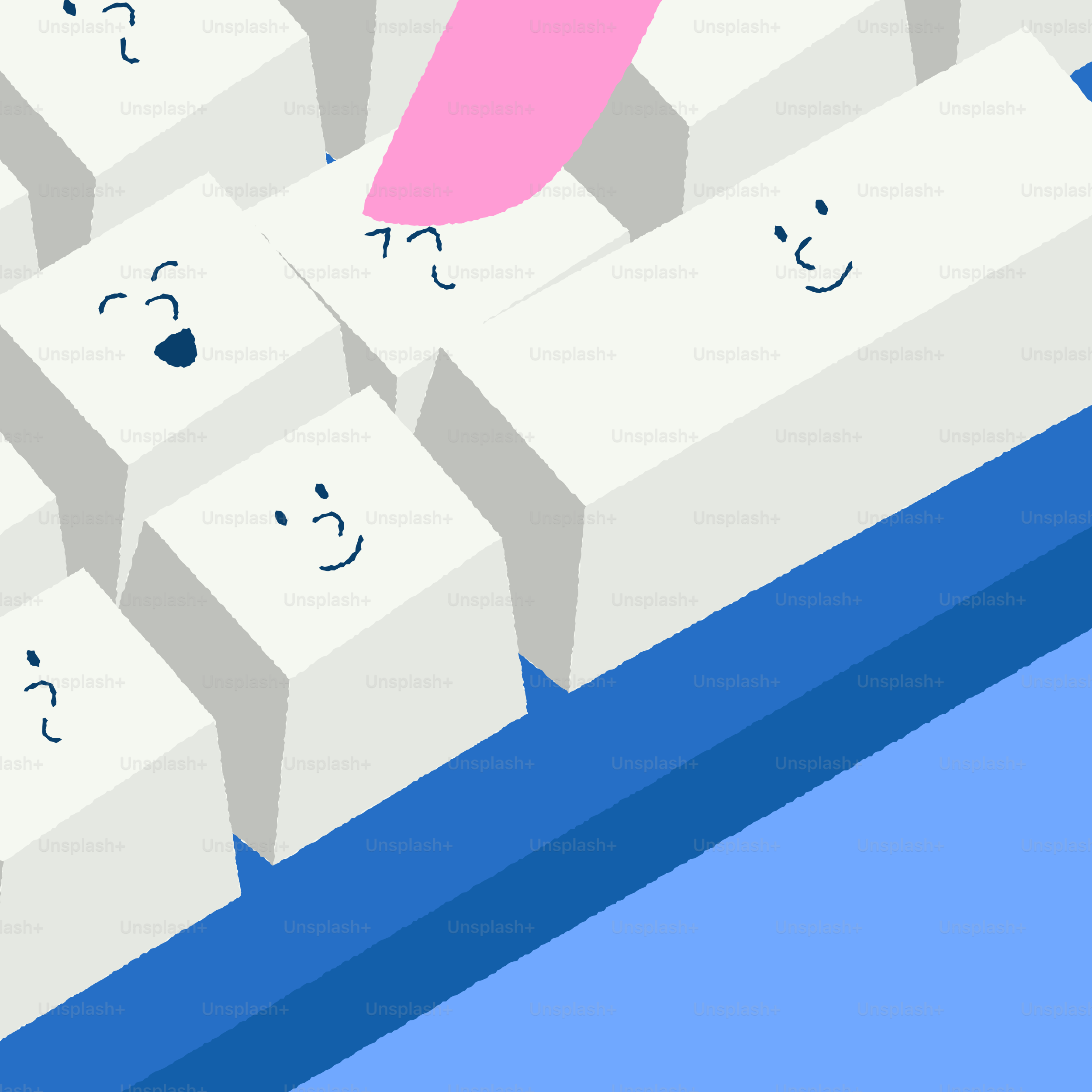 Close-up of white keyboard keys with cartoon faces.