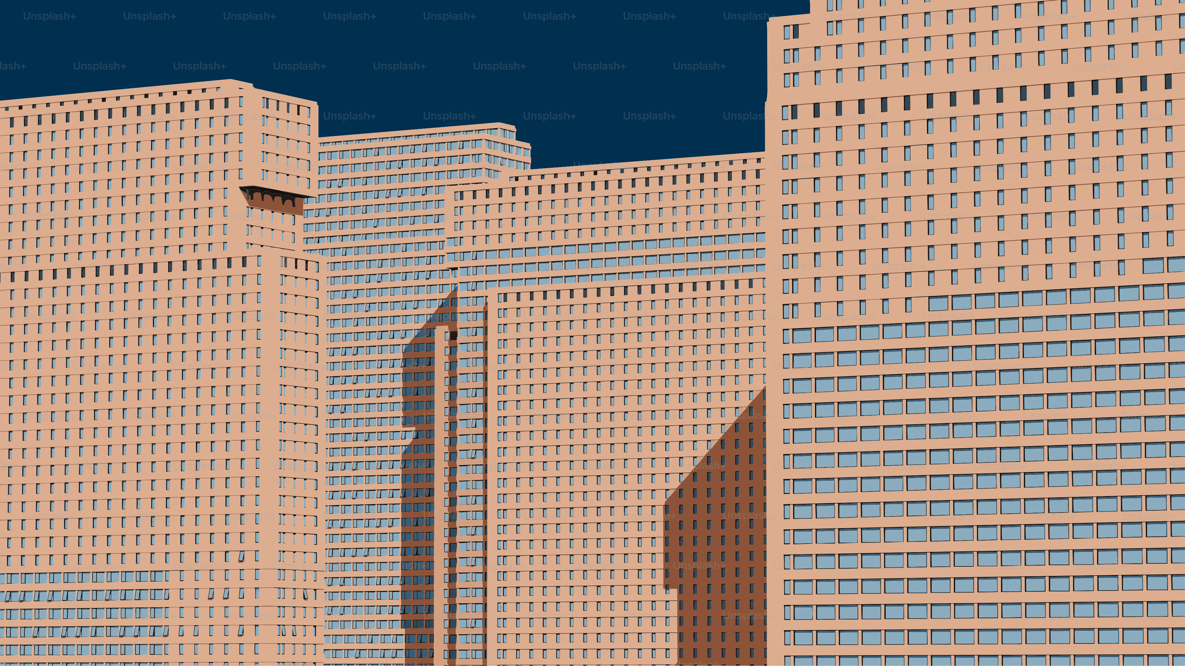 짙은 푸른 하늘을 배경으로 한 현대적인 아파트 건물