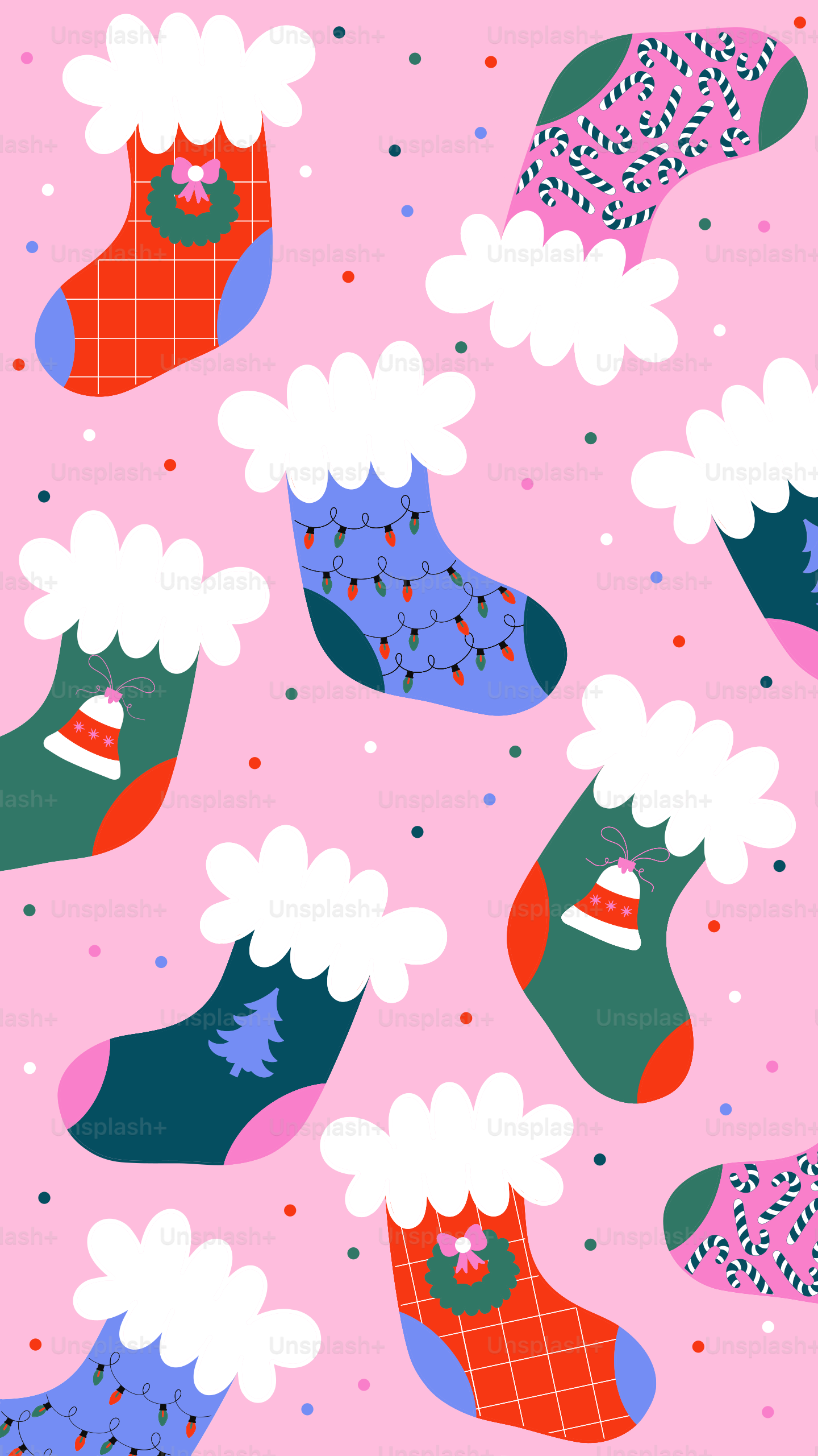 Christmas stockings with festive patterns on pink background