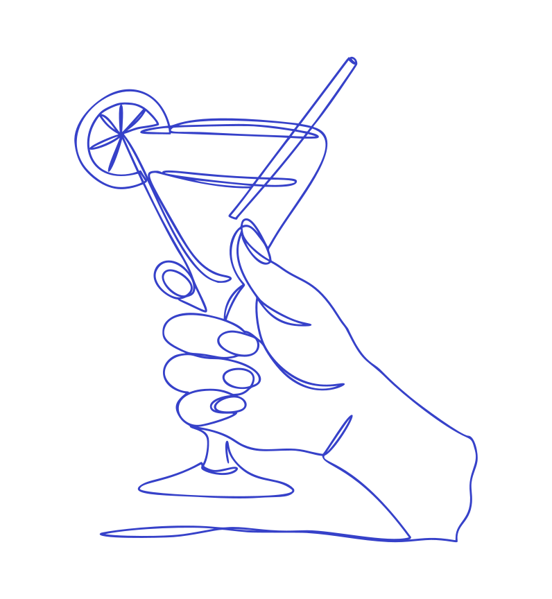 Hand holding a martini with lemon slice and straw