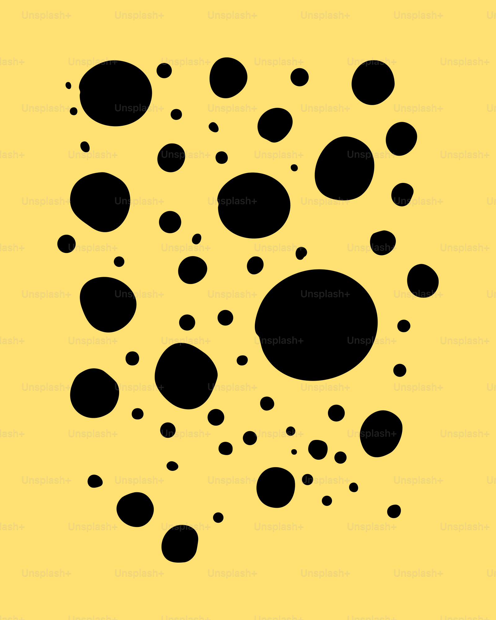 Scattered black circles on a yellow background