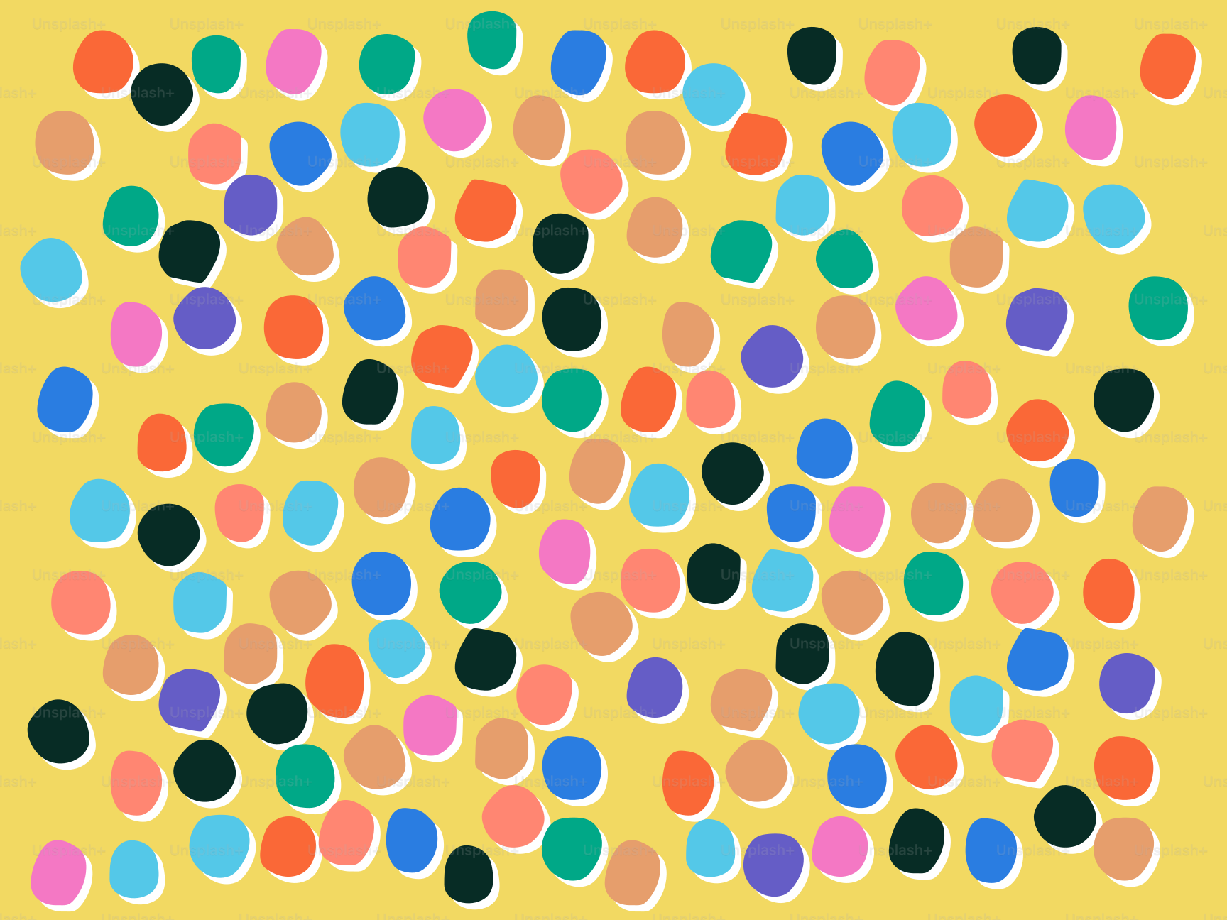 Colorful polka dots scattered on a yellow background