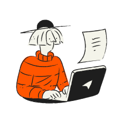 Person wearing orange sweater typing on laptop