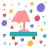 Una lámpara rosa está sobre una mesa verde azulado con confeti.