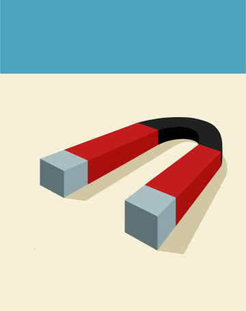 A red horseshoe magnet on a beige surface.