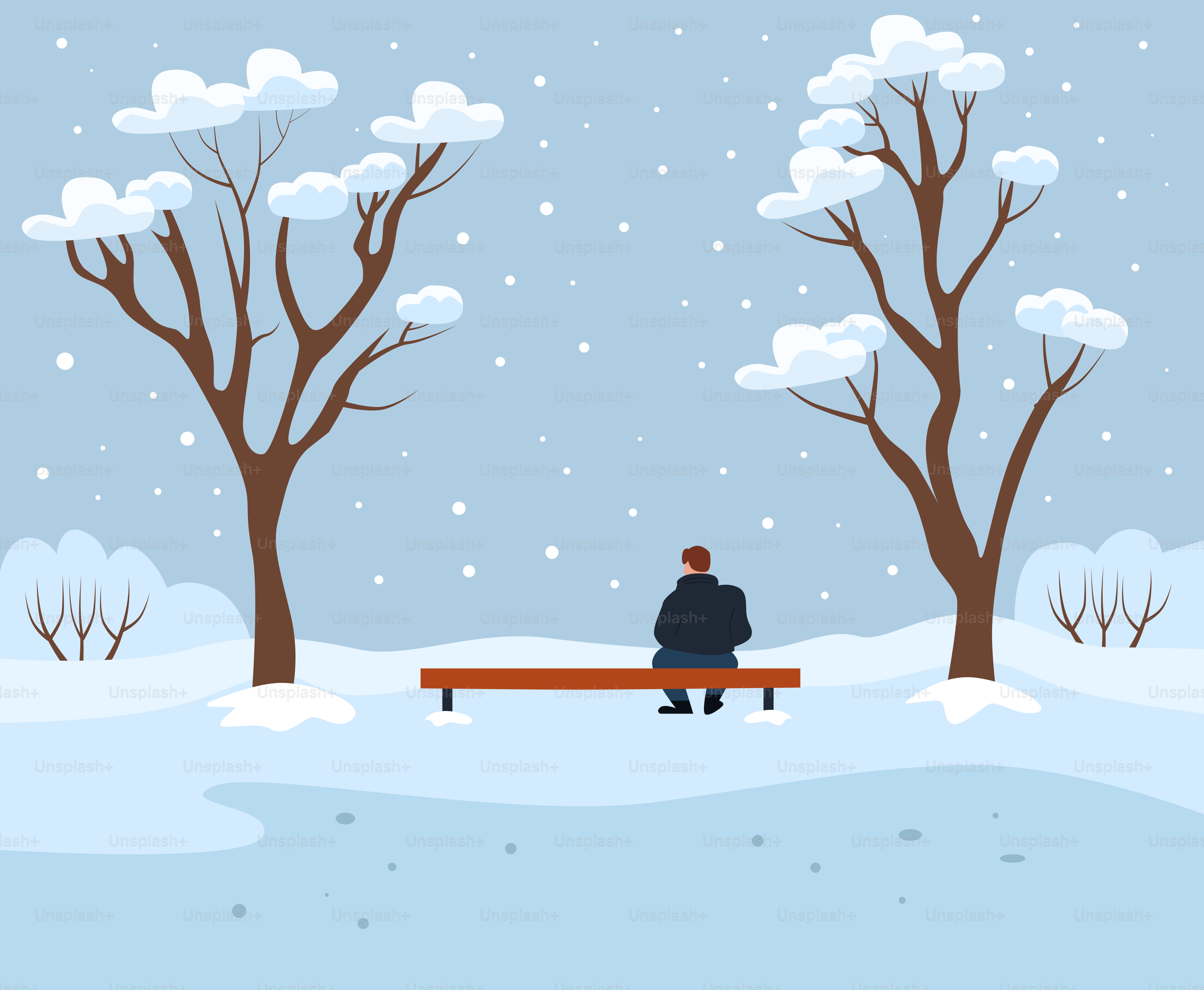 Man sitting on bench in snowy park