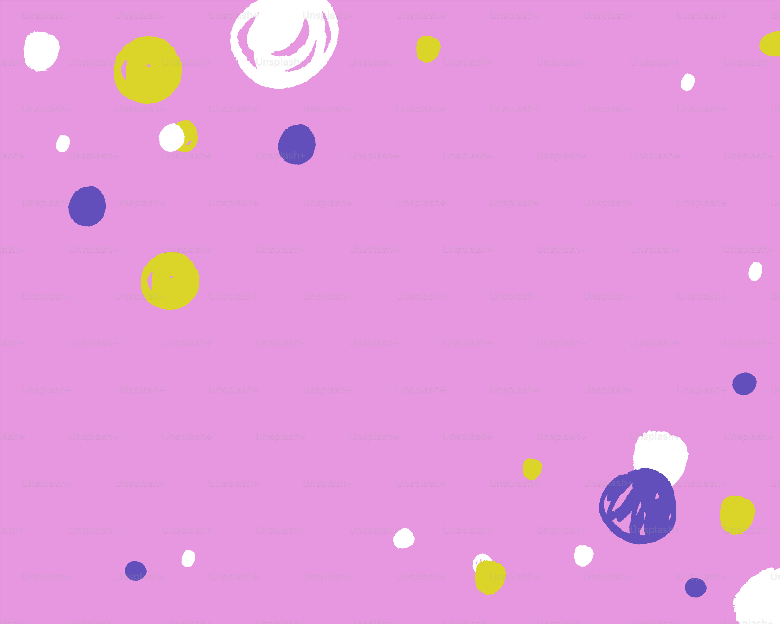 ピンクの背景に散らばるカラフルな円