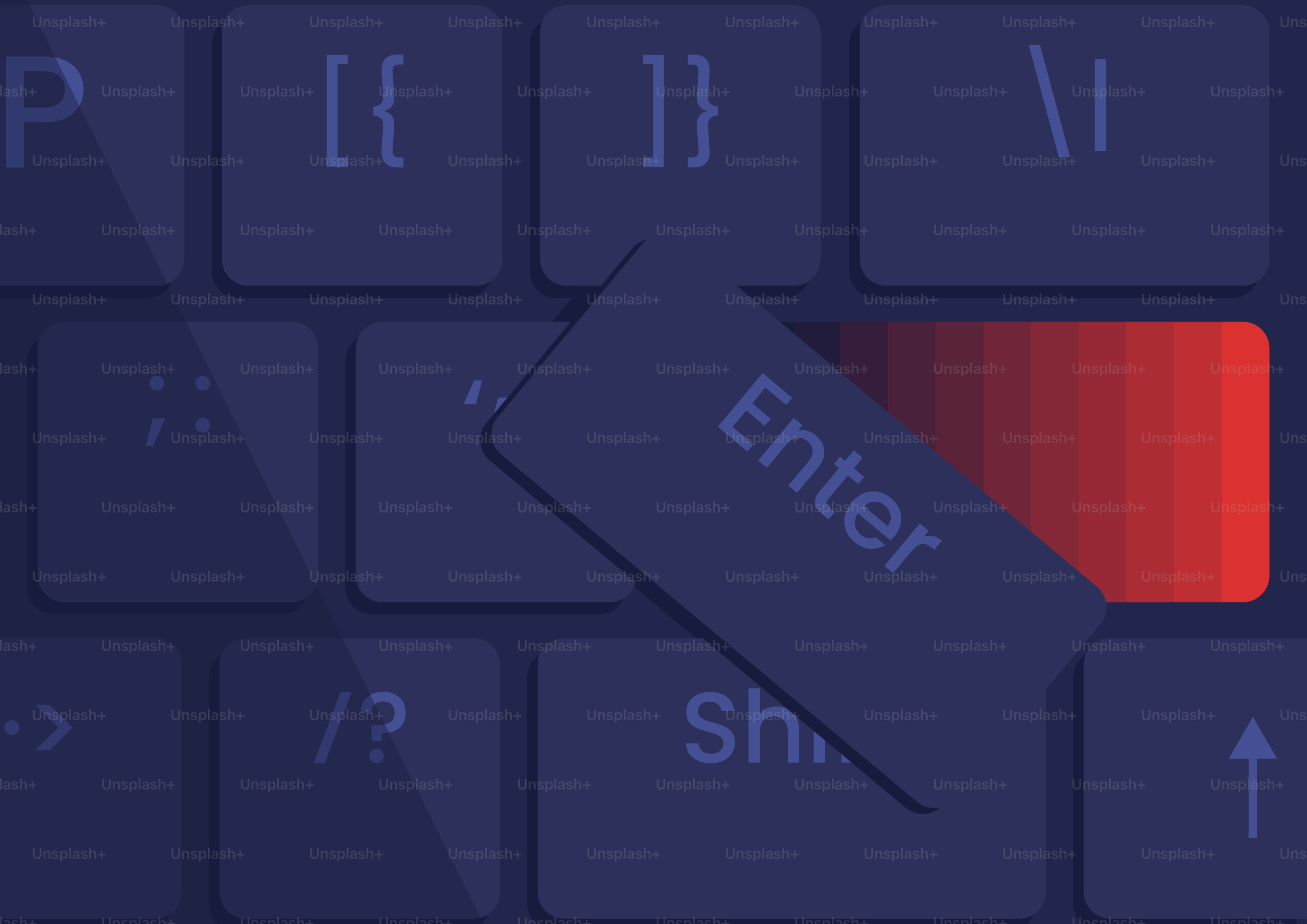 Close-up of a dark keyboard with a red enter key