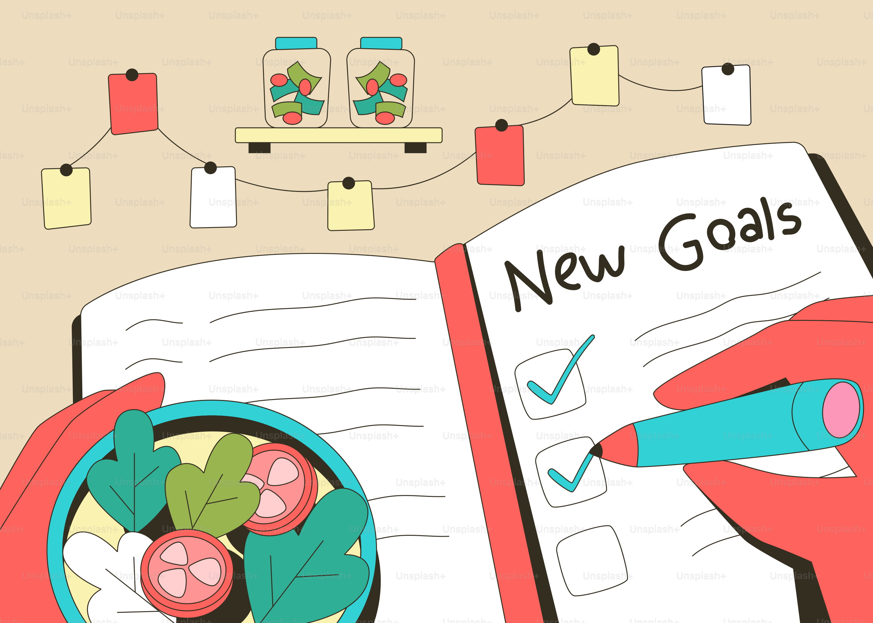Hand writing new goals next to a healthy salad