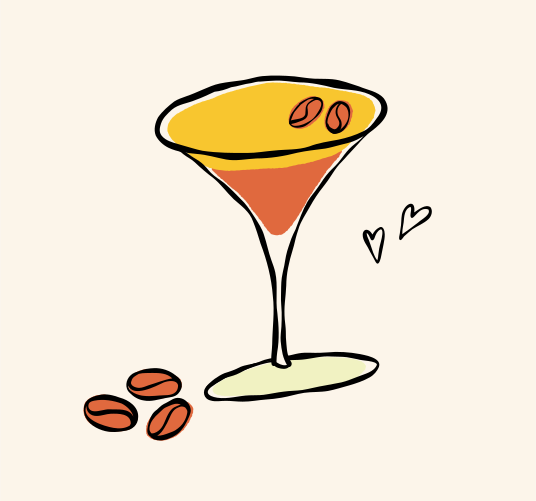 A martini glass with coffee beans and hearts