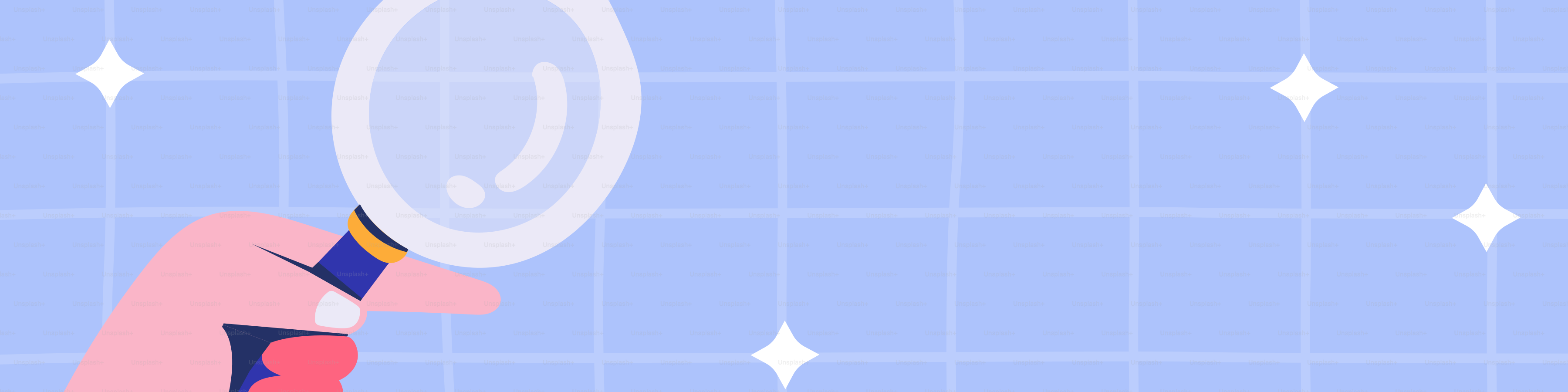 Hand holding magnifying glass over blue grid