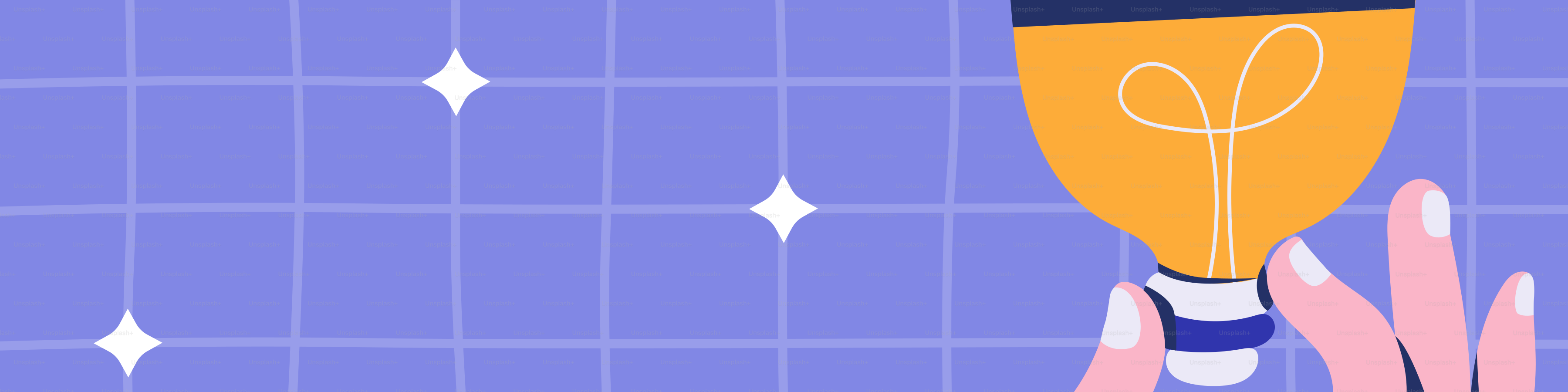 Hand holding a glowing light bulb with stars