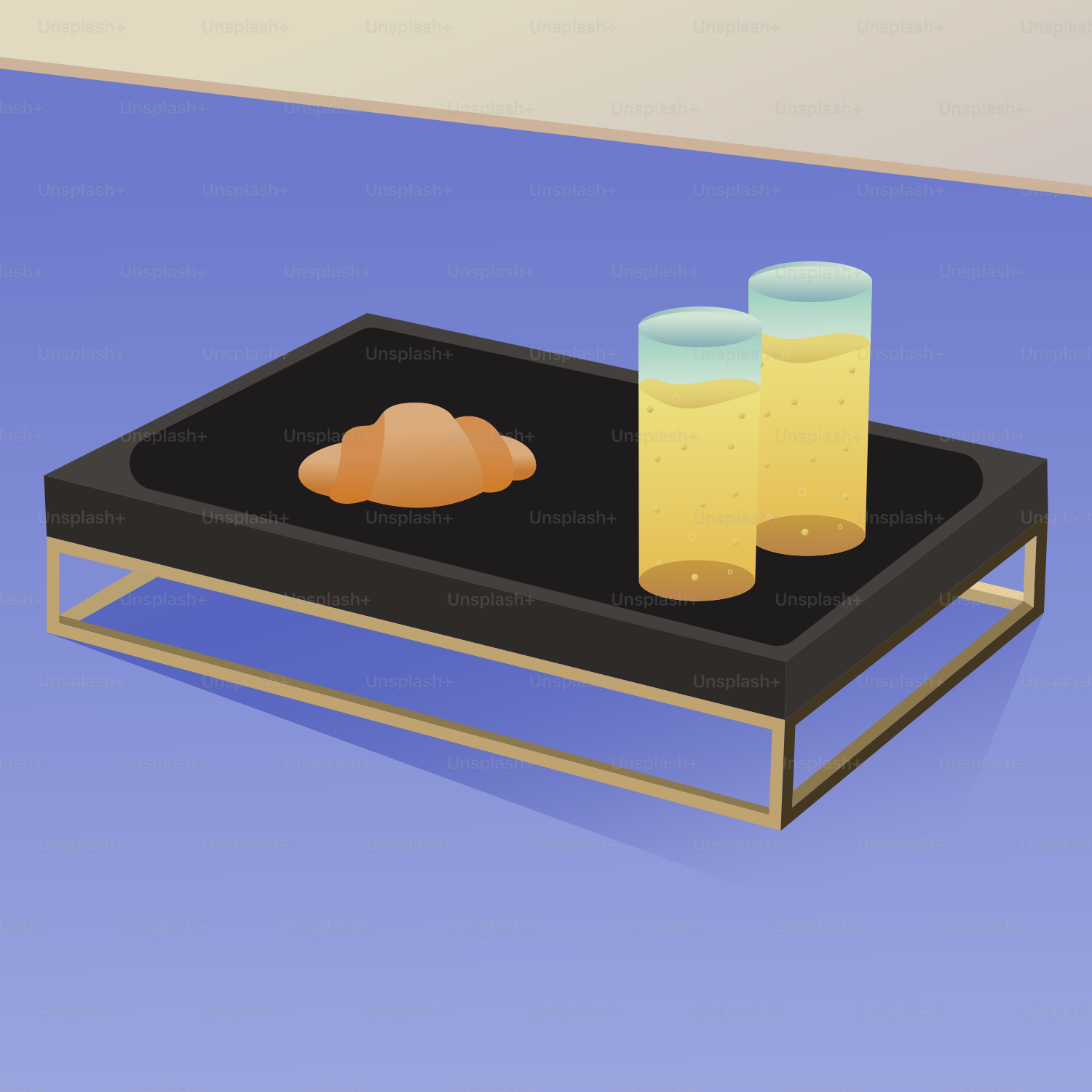 Croissant and two glasses of juice on a tray