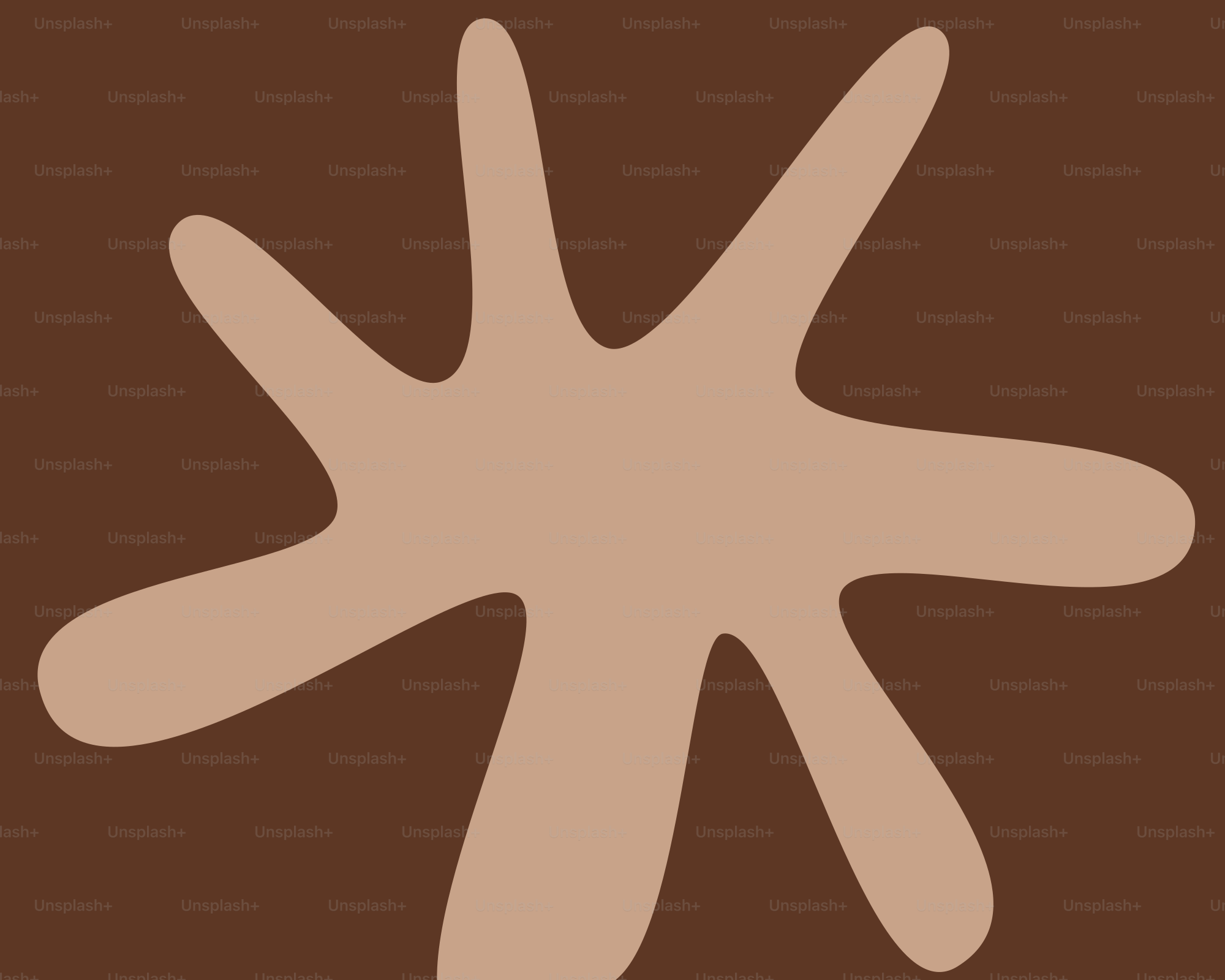 Una macchia marrone chiaro su uno sfondo marrone scuro.