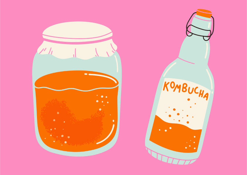 Jar and bottle of orange kombucha drink
