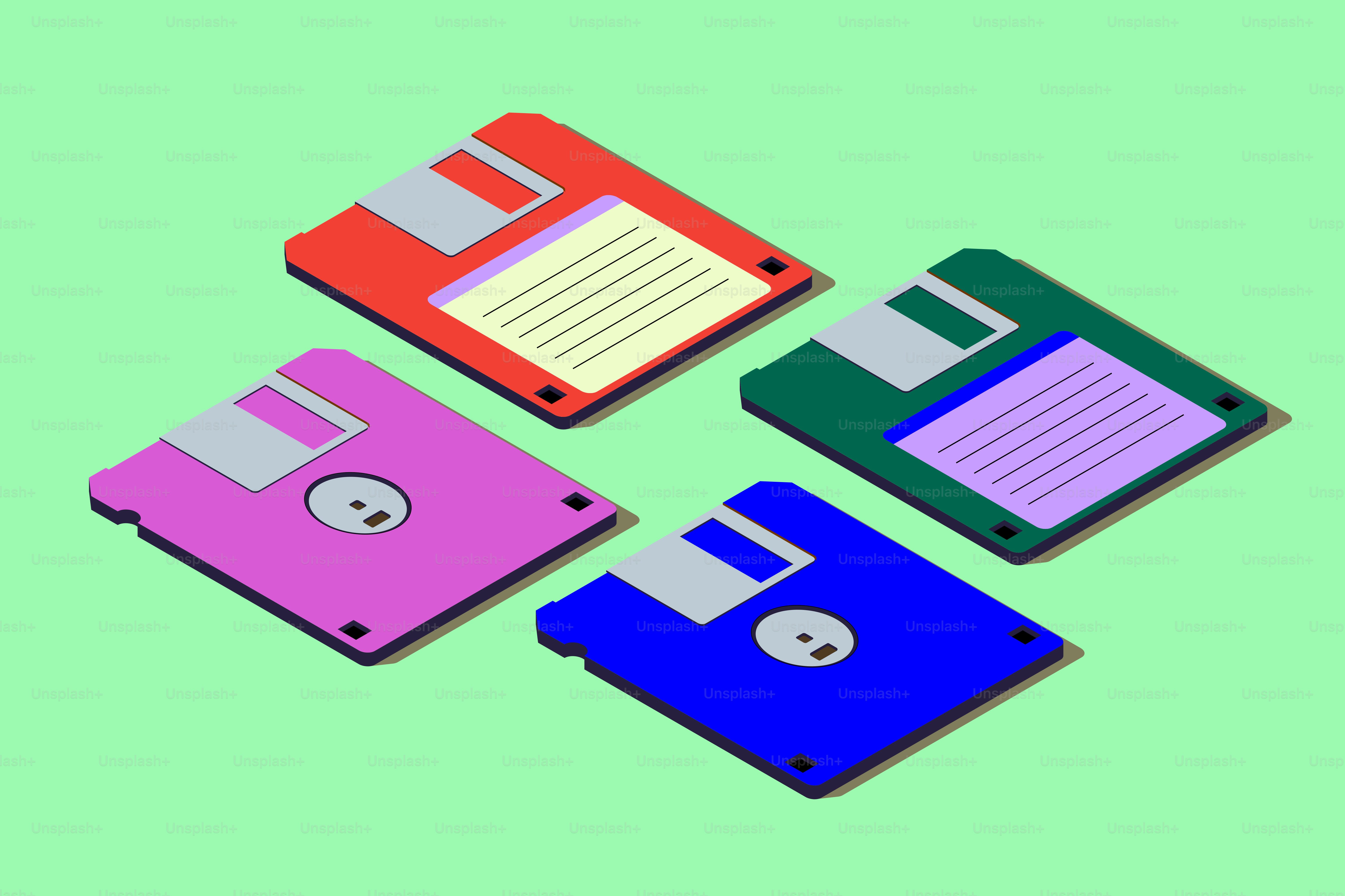 Quattro floppy disk colorati su uno sfondo verde