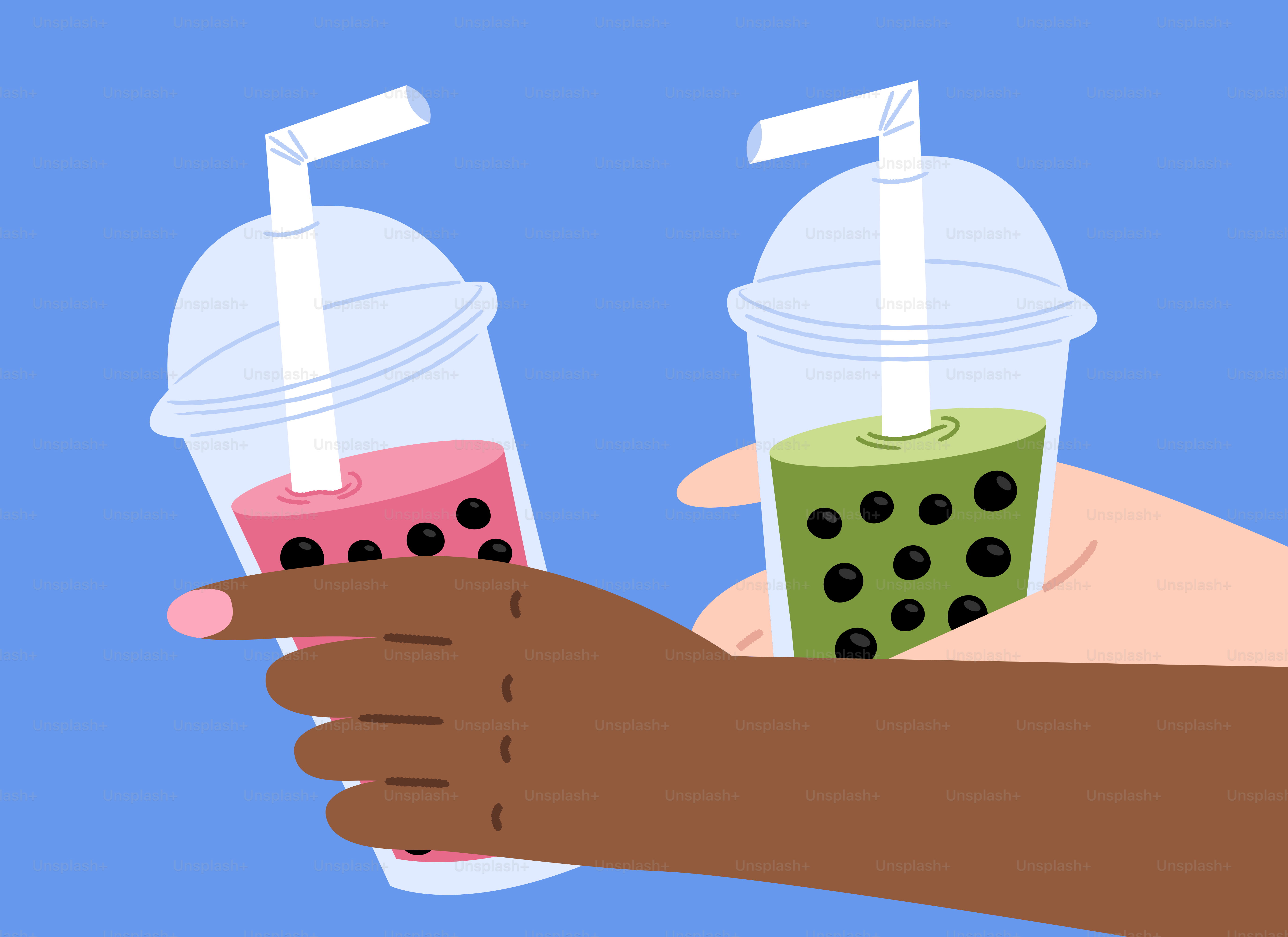 Two hands holding bubble tea drinks