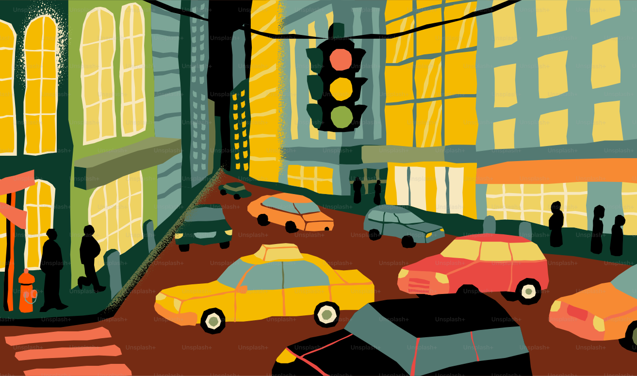 Cars and buildings on a city street at night.