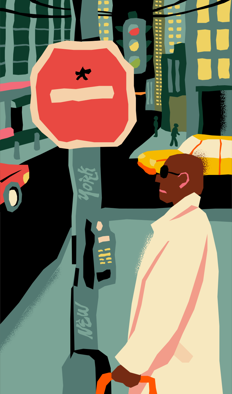 Un hombre con abrigo espera en una esquina de la ciudad.