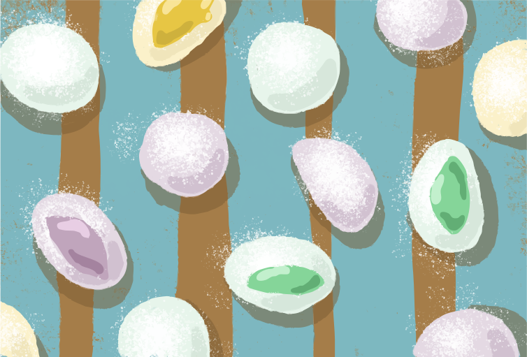 Colorful mochi candies on a striped background