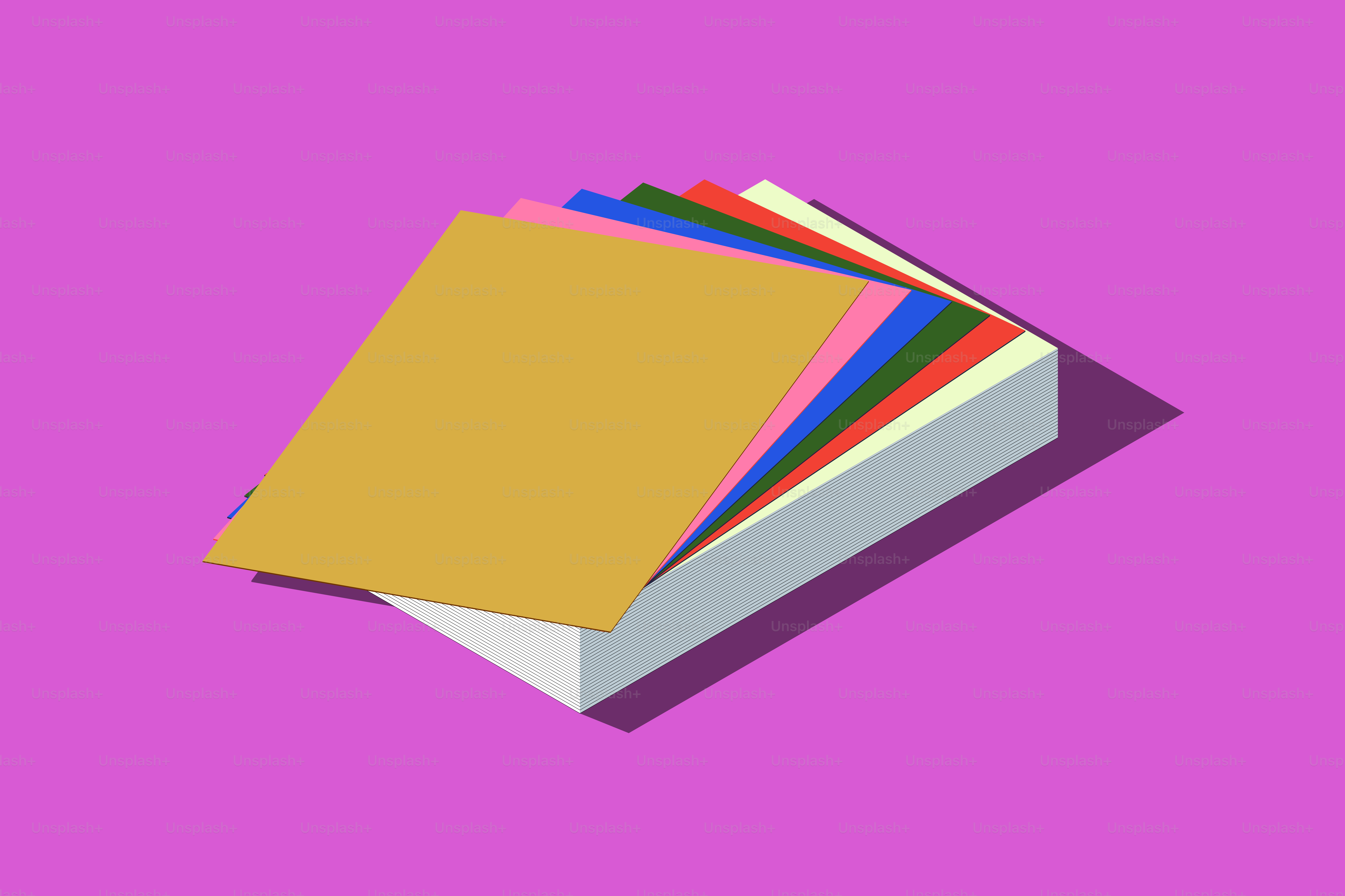 Stack of colorful paper sheets on purple background
