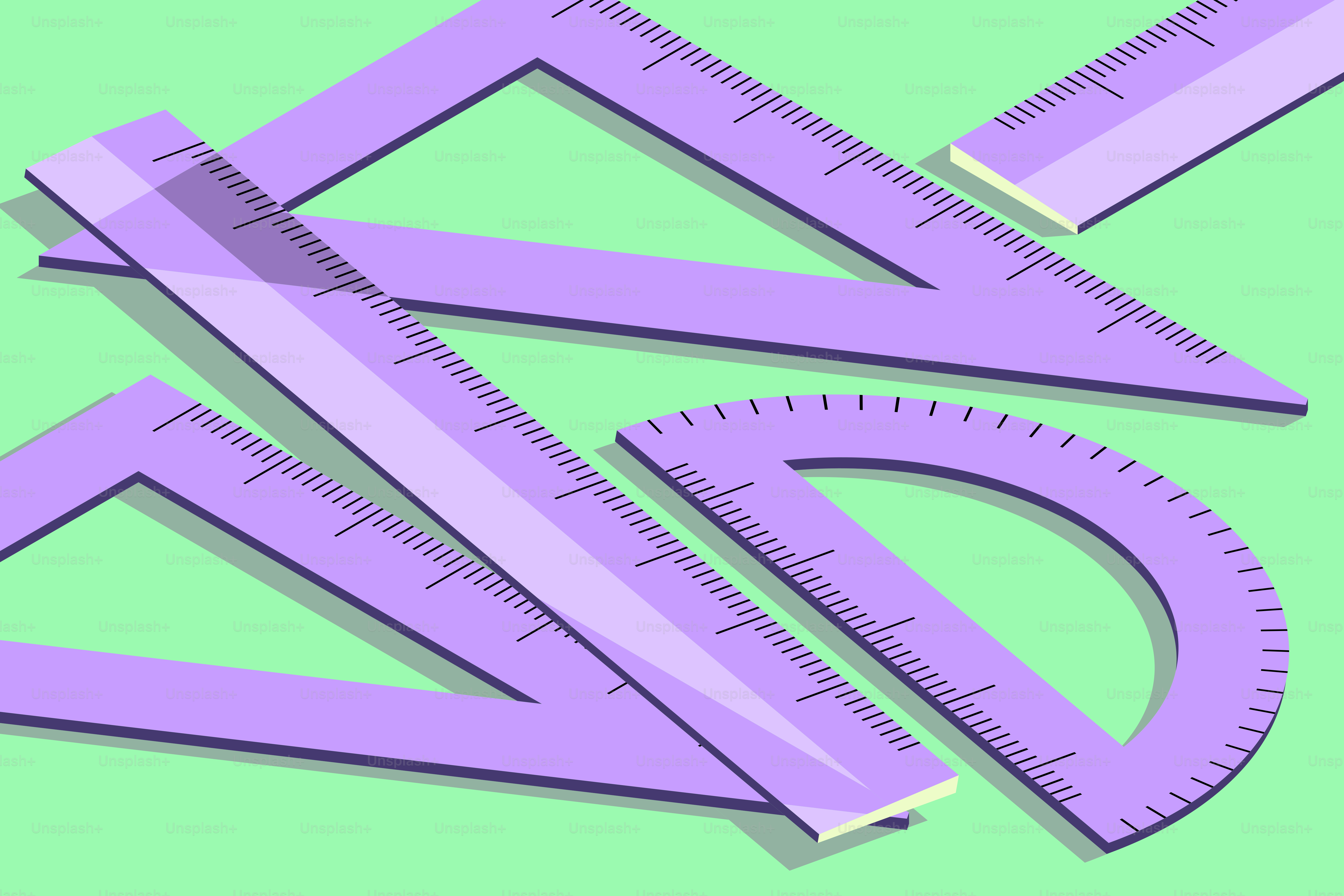 Purple rulers and protractor on a green background