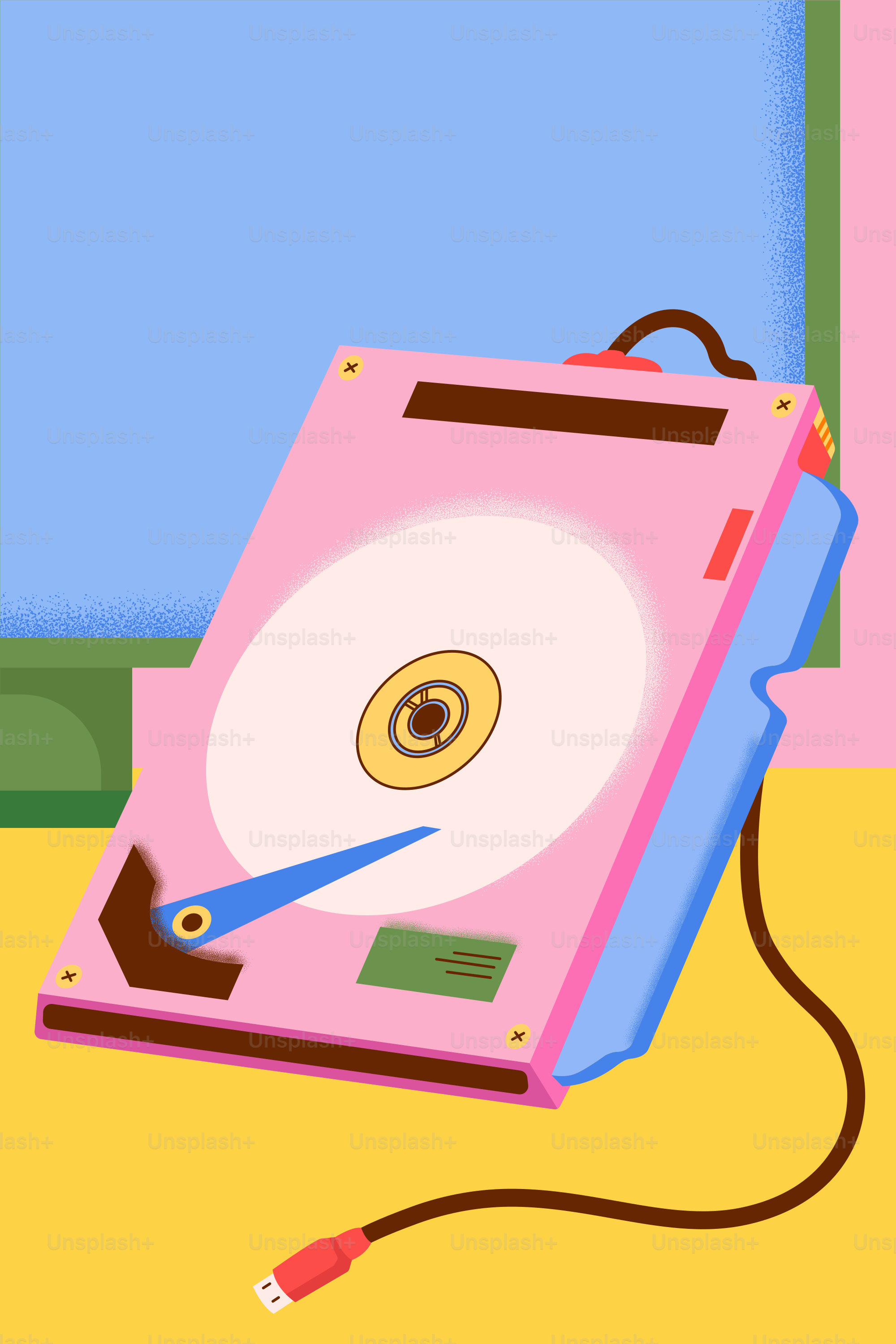 Pink hard drive with usb cable on yellow surface