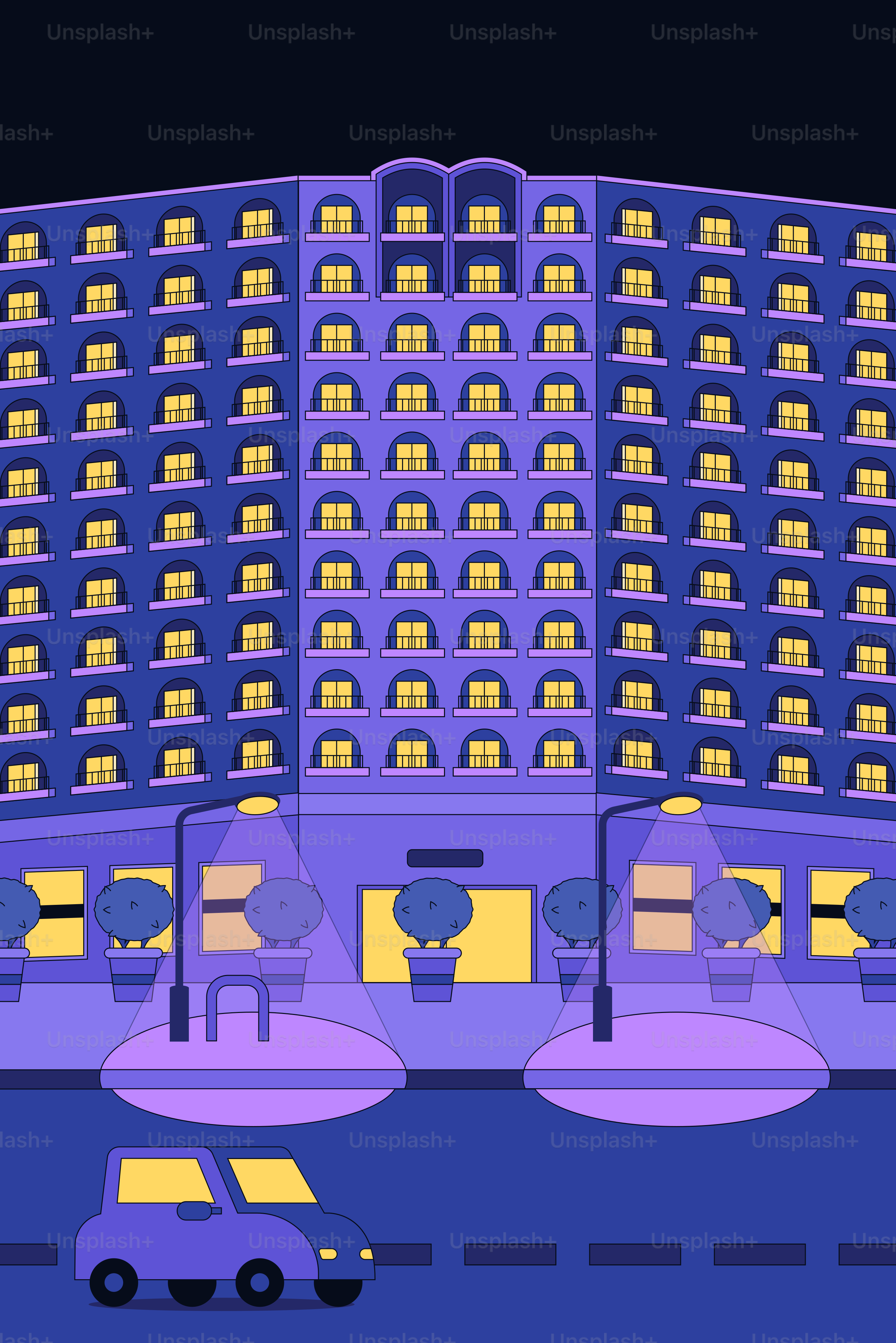 밤에 빛나는 창문이 있는 현대식 건물.