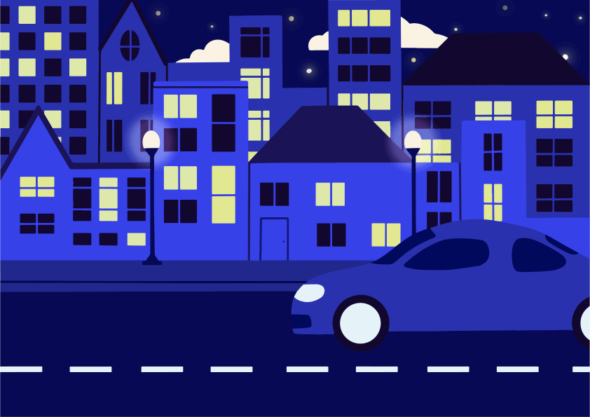 Une voiture bleue roule dans une rue la nuit.