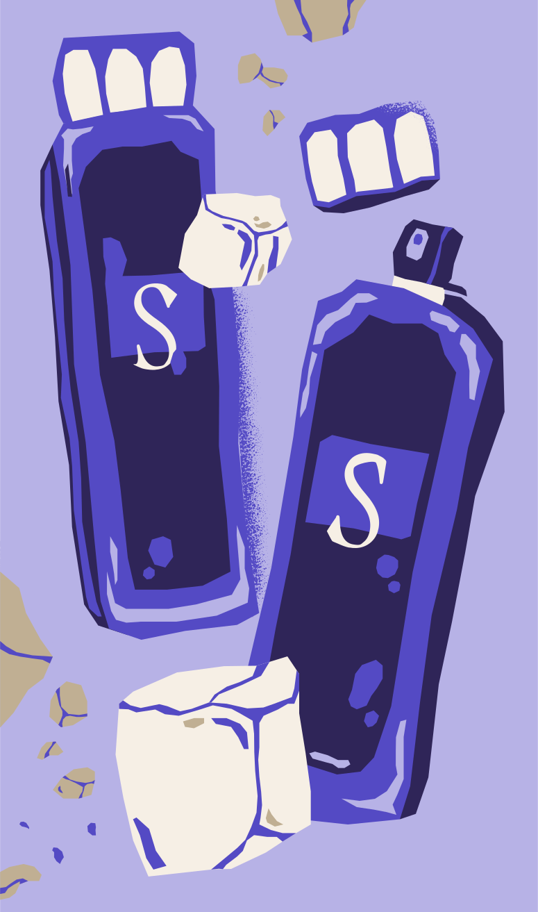 Two purple bottles with white cubes and debris