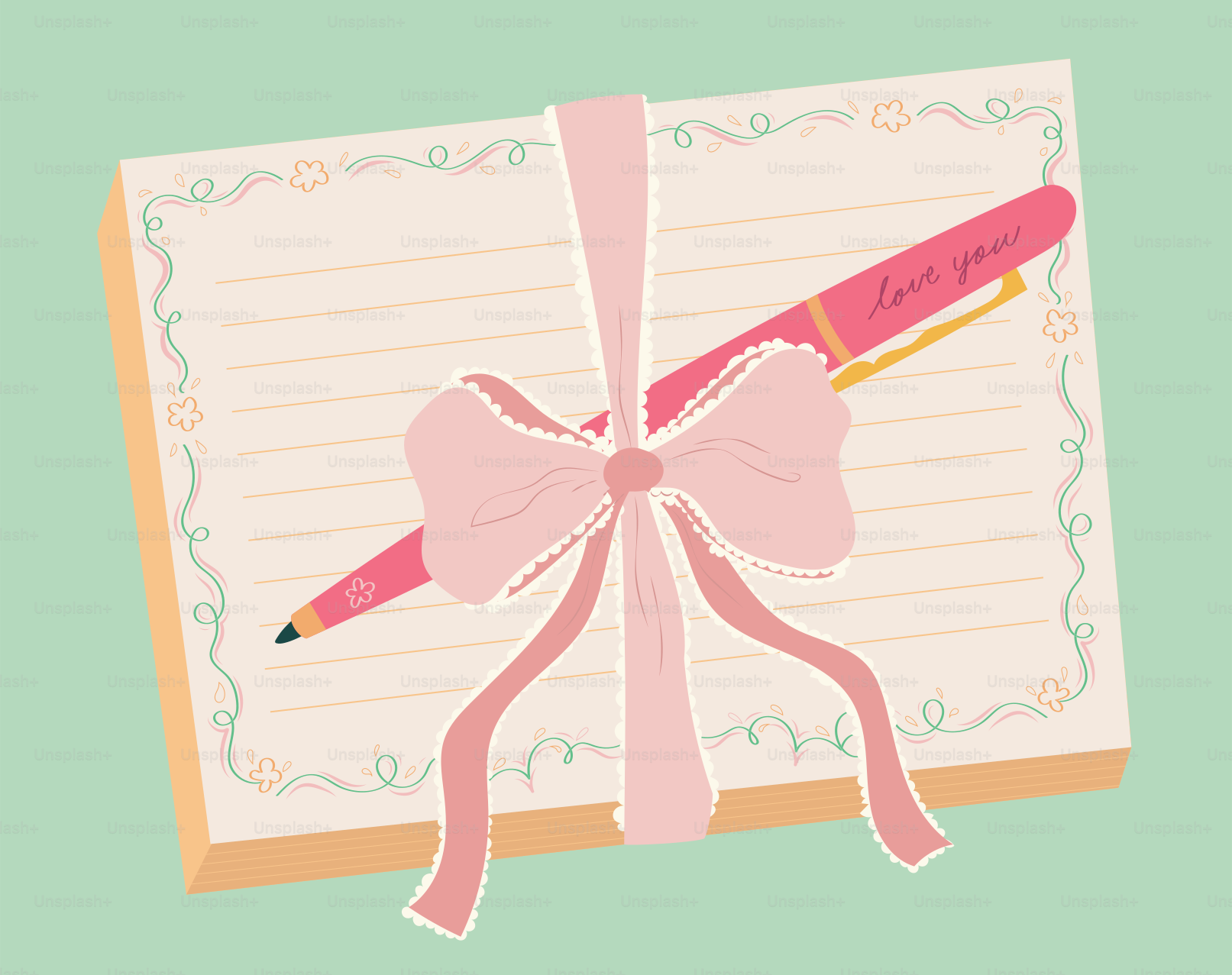 Stylo rose et papeterie attachés avec un ruban